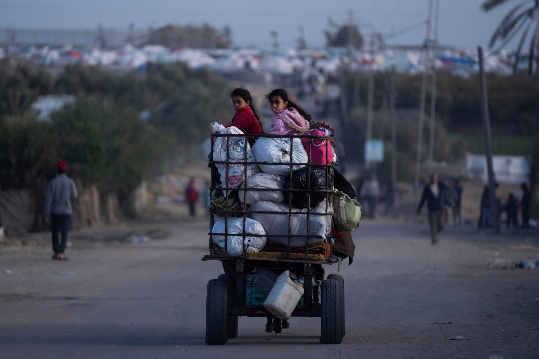 <p>Palestinians who flee from Khan Younis from Israeli ground and air offensive on the Gaza Strip arrive in Rafah, southern Gaza, Monday, Jan. 22, 2024. (AP Photo/Fatima Shbair)</p>   PHOTO CREDIT: Fatima Shbair 