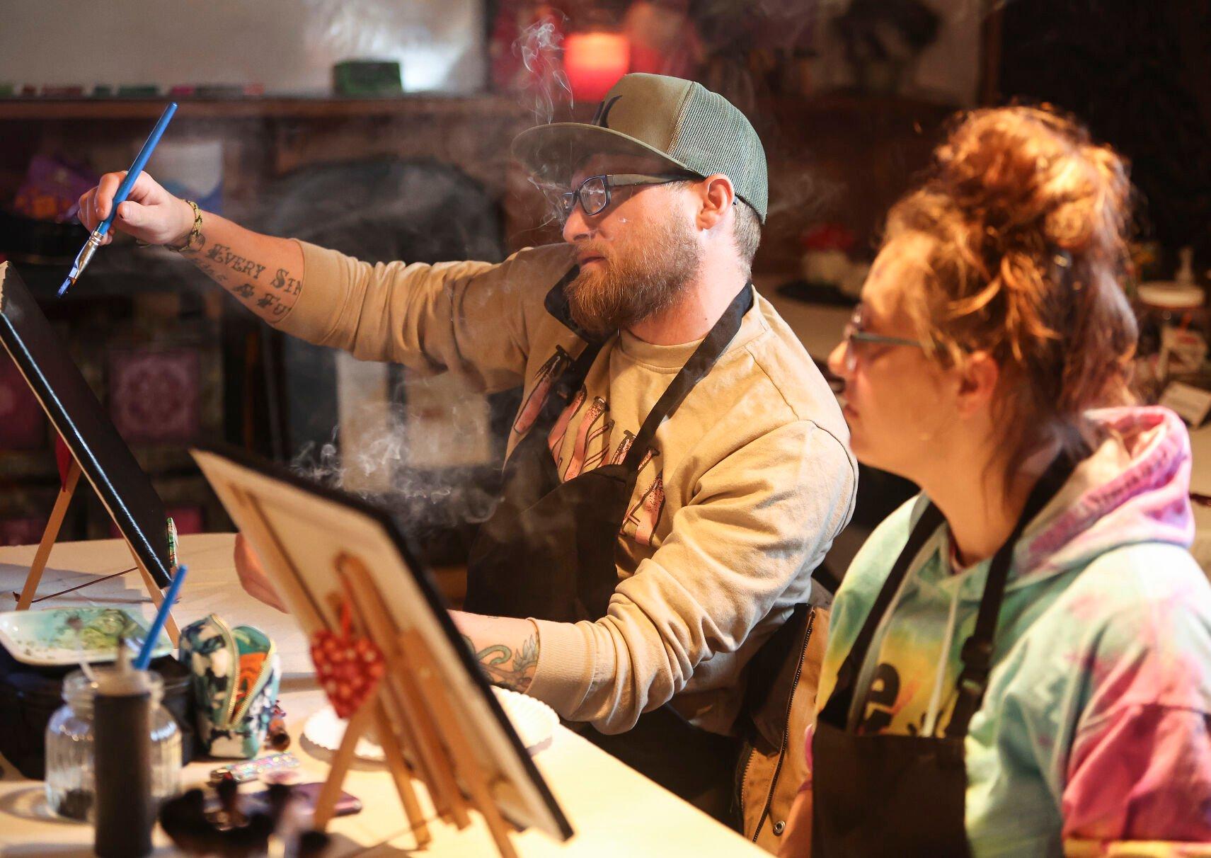 Eddie Klein (left) and Racheal Reynolds, both of Lancaster, Wis., take part in a painting class held at The Stoned Painter located in East Dubuque, Ill.    PHOTO CREDIT: Dave Kettering
Telegraph Herald