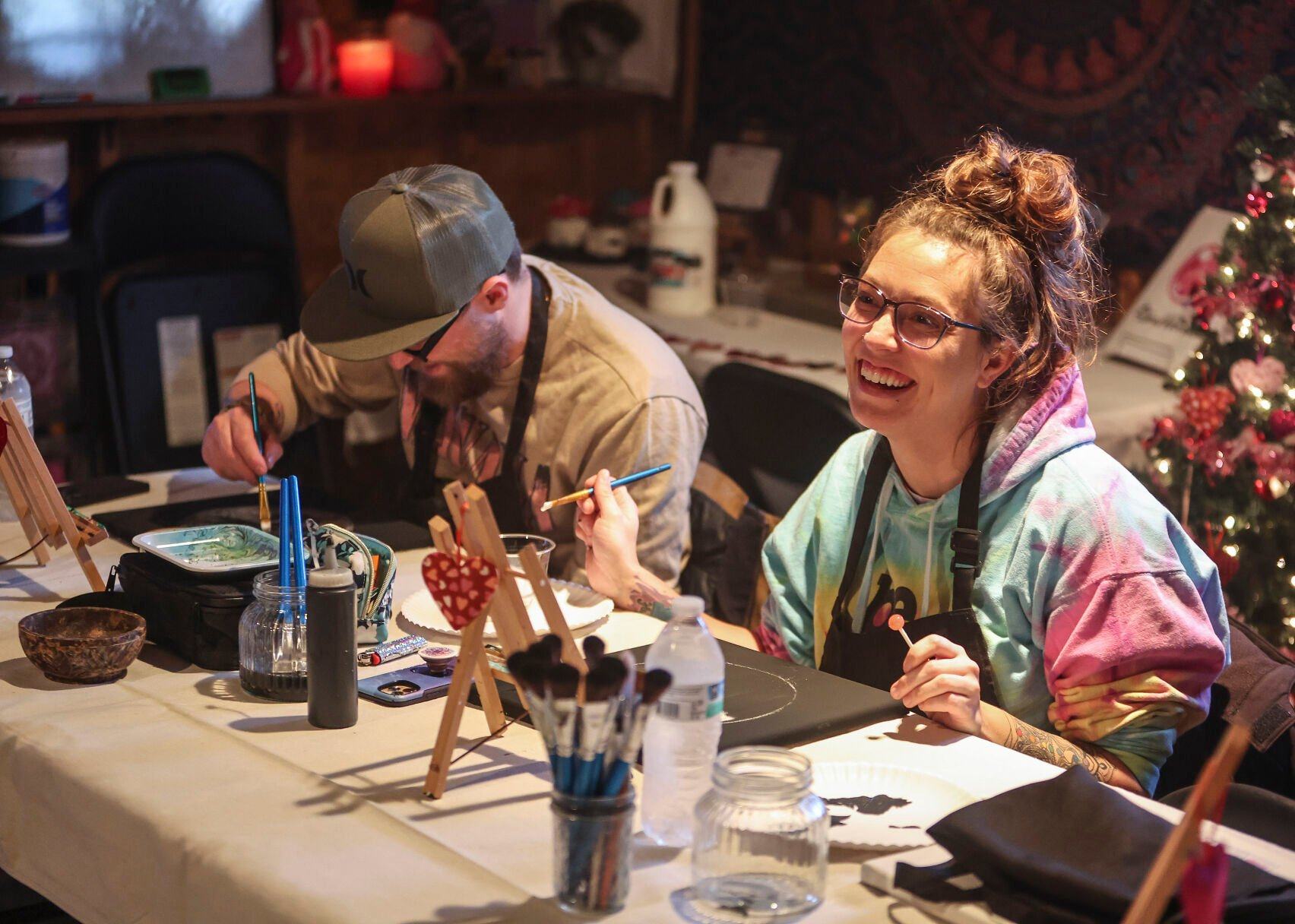 Eddie Klein (left) and Racheal Reynolds, both of Lancaster, Wis., take part in a painting class held at The Stoned Painter located in East Dubuque, Ill.    PHOTO CREDIT: Dave Kettering
Telegraph Herald