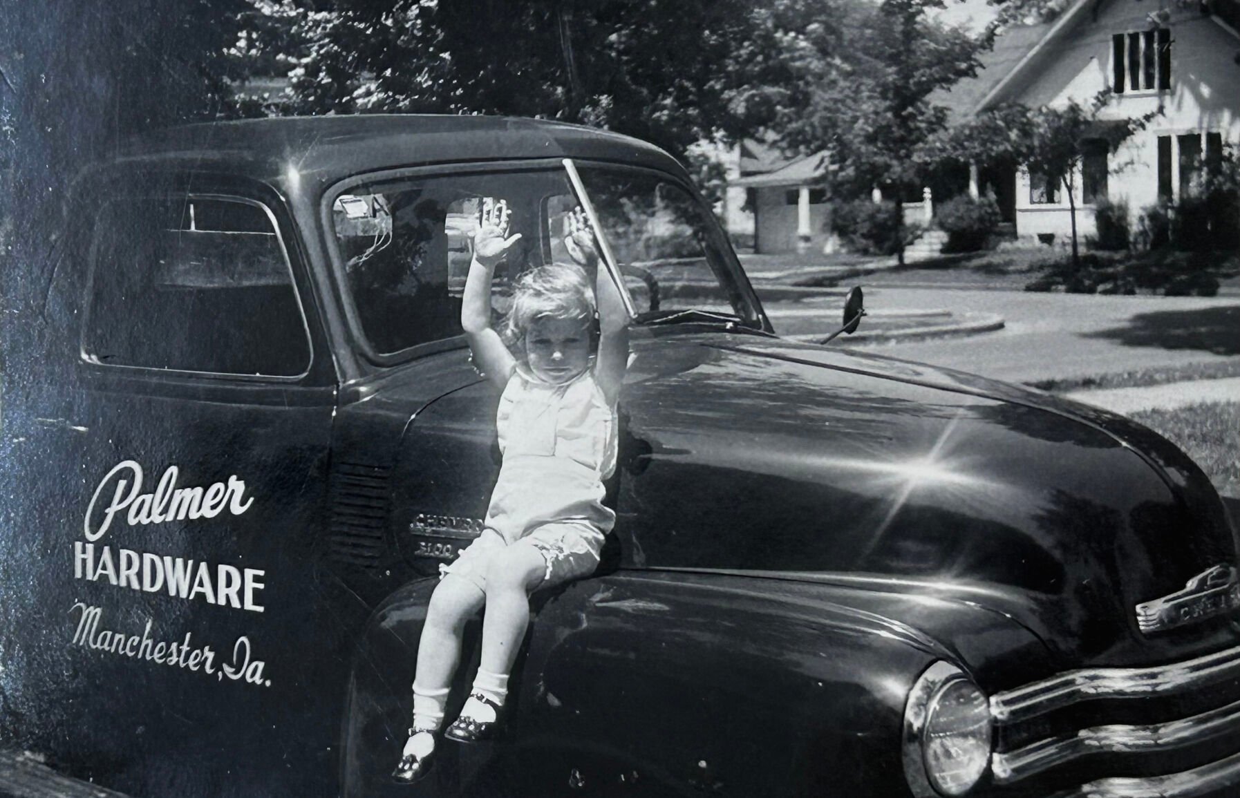 An undated photo shows Ellen (Palmer) Wehrle sitting on the first Palmer Hardware truck.    PHOTO CREDIT: Contributed