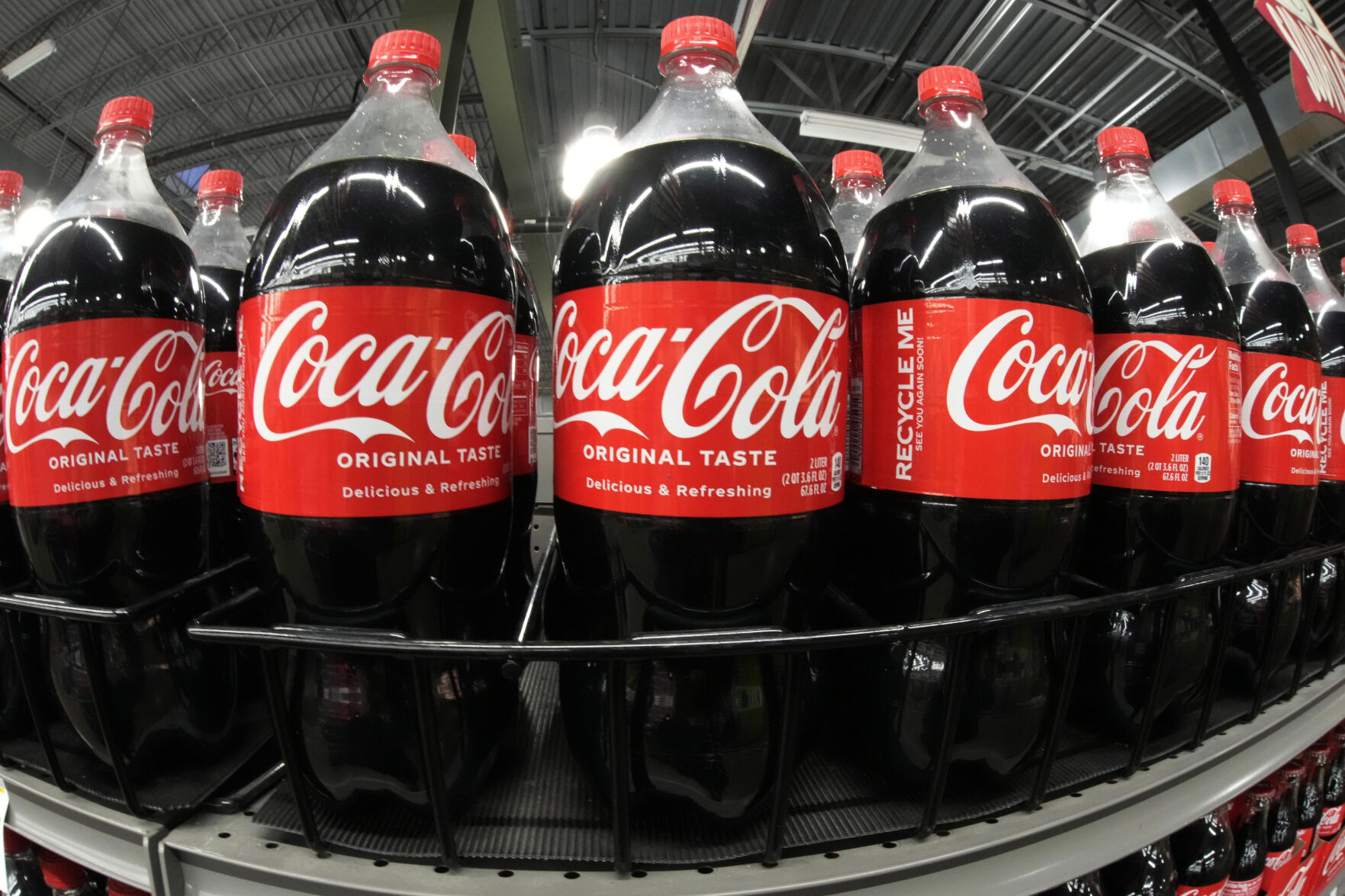 <p>FILE - Bottles of Coca Cola are shown in a market in Pittsburgh on Jan. 26, 2023. Coca Cola reports results on Tuesday, Feb. 13, 2024. (AP Photo/Gene J. Puskar)</p>   PHOTO CREDIT: Gene J. Puskar