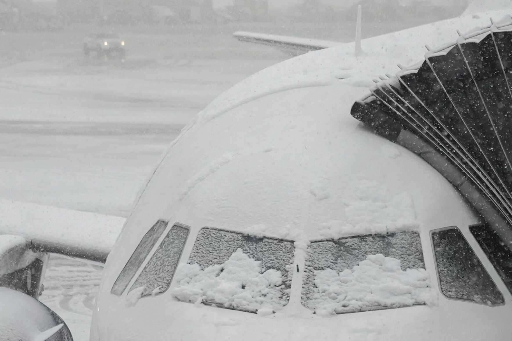 <p>Snow covers the windows of a plane that sits at a gate at John F. Kennedy International Airport, Tuesday, Feb. 13, 2024, in New York. (AP Photo/Frank Franklin II)</p>   PHOTO CREDIT: Frank Franklin II 