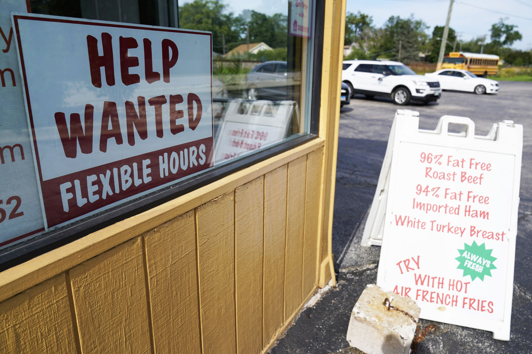 <p>FILE - A "Help Wanted" sign is displayed in Deerfield, Ill., Wednesday, Sept. 21, 2022. The year looks to be a much better one for the U.S. economy than business economists were forecasting just a few months earlier, according to a survey released Monday, Feb. 26, 2024. (AP Photo/Nam Y. Huh)</p>   PHOTO CREDIT: Nam Y. Huh - staff, ASSOCIATED PRESS