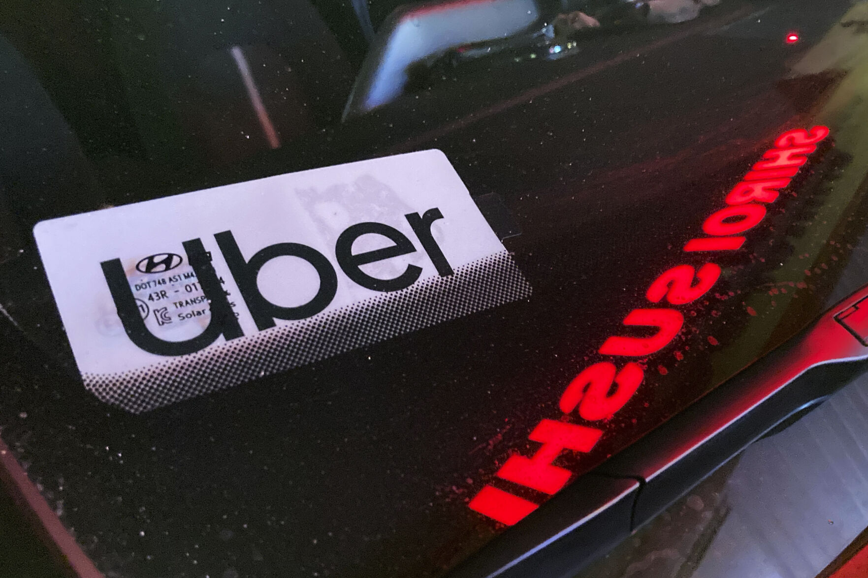 <p>FILE - An Uber sign is displayed inside a car in Glenview, Ill., Saturday, Dec. 17, 2022. Consumers will pay more for that airline flight or willing to fork out more for a ride on Uber during rush hour. But a big shopper backlash to media reports this past week that fast-food chain Wendy’s had plans to increase prices during the busiest time at its restaurants clearly showed that consumers don’t want basic food items like hamburgers and shakes going up and down(AP Photo/Nam Y. Huh, File)</p>   PHOTO CREDIT: Nam Y. Huh 