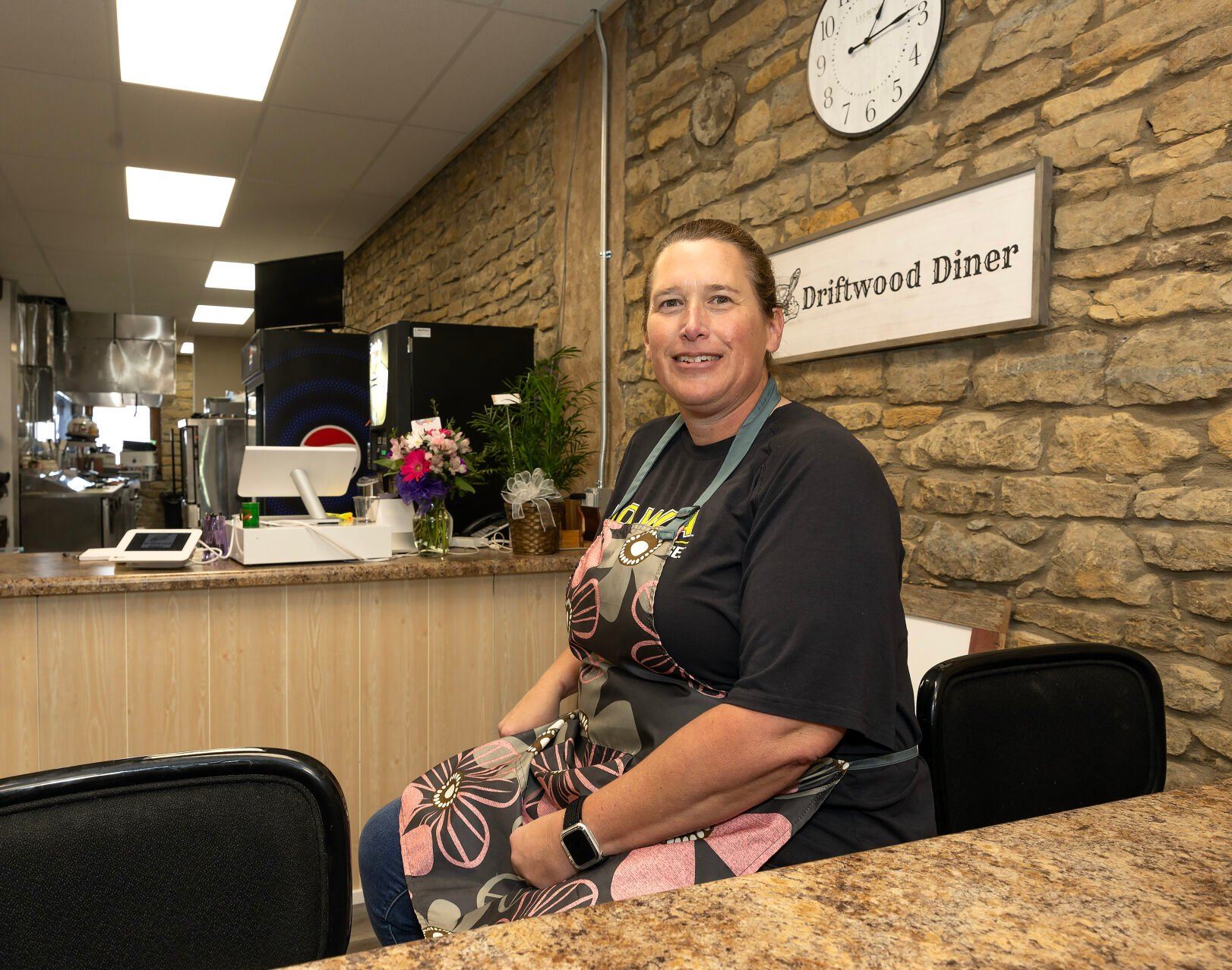Owner Ann Moore sits at a counter inside Driftwood Diner in Guttenberg, Iowa, on Thursday.    PHOTO CREDIT: Stephen Gassman