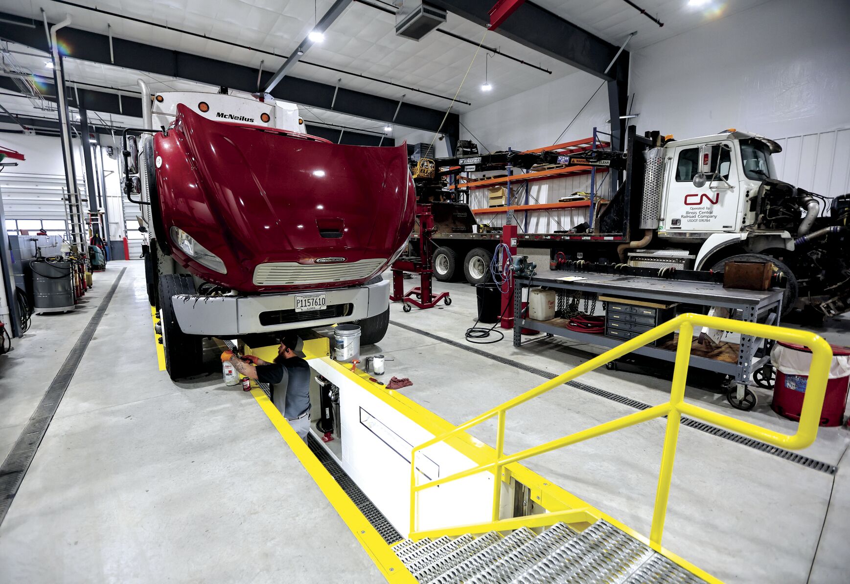 An employee with Guy’s Towing & Service in Galena, Ill., works in the new space on Friday. The longtime family business has opened a new 21,000-square-foot building specializing in repairs and maintenance for trucks, trailers and heavy machinery.    PHOTO CREDIT: Dave Kettering