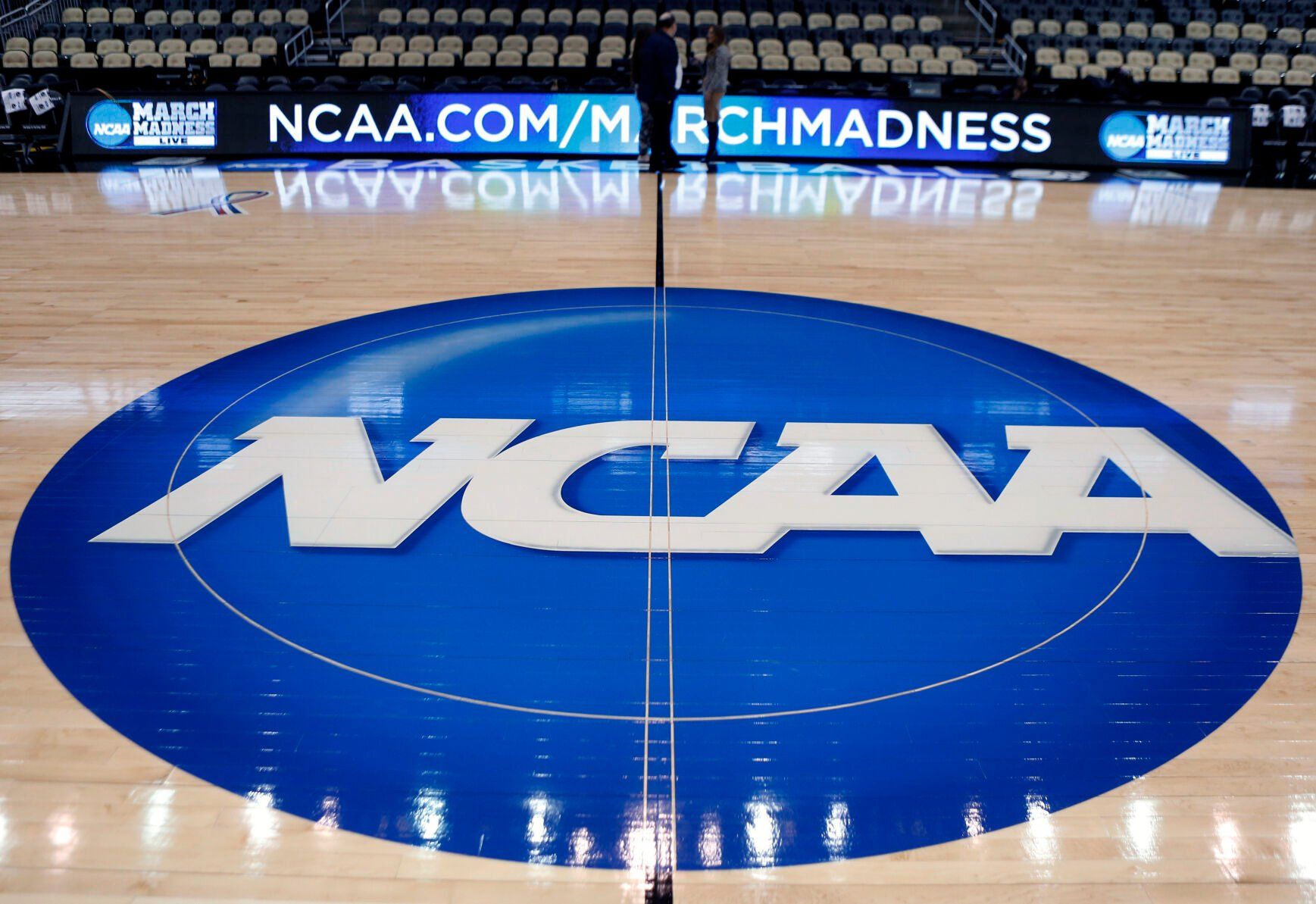 <p>FILE - In this March 18, 2015, file photo, the NCAA logo is displayed at center court at The Consol Energy Center in Pittsburgh. More than half of Americans say they are against college athletes unionizing, though younger respondents were more supportive than older, according to a new poll from The Associated Press-NORC Center for Public Affairs Research. (AP Photo/Keith Srakocic, File)</p>   PHOTO CREDIT: Keith Srakocic 