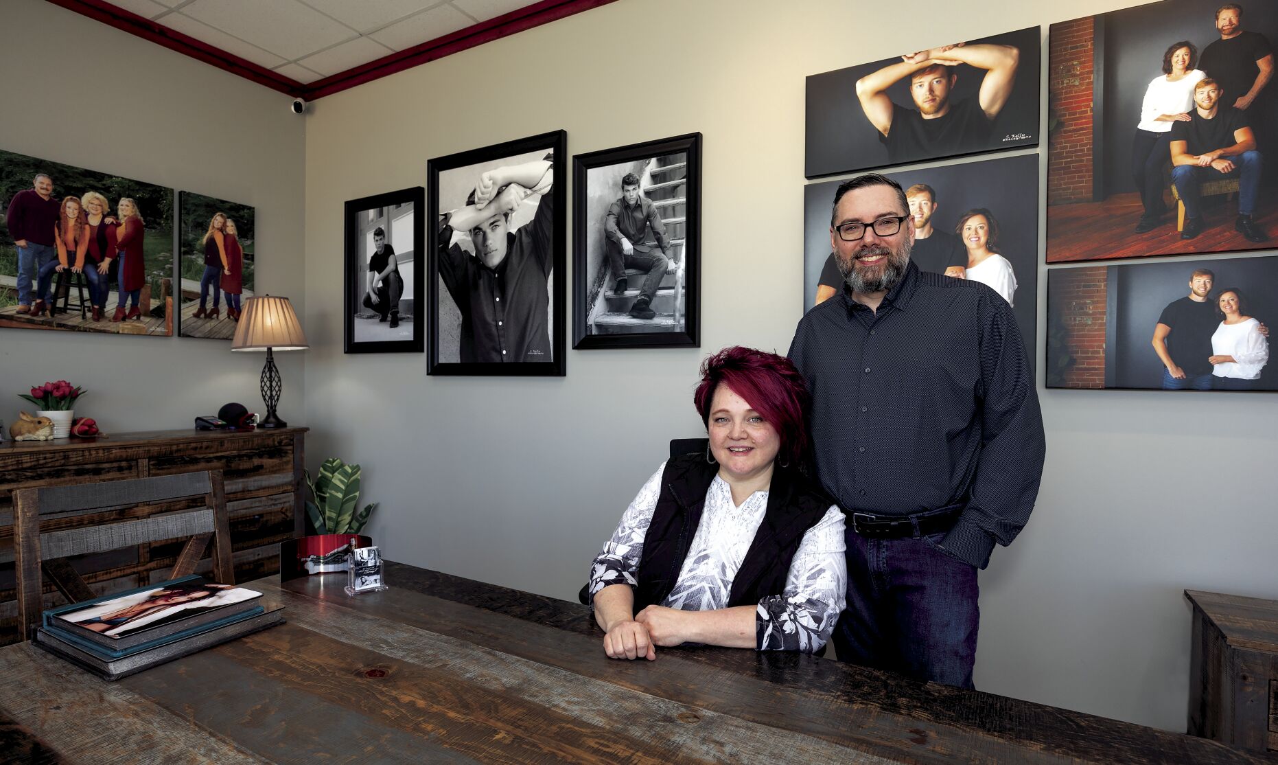 Kris and Scott Kelly, co-owners of Scott Kelly Portraits, pose in their Dubuque studio at 150 John F. Kennedy Road, Suite 1, after relocating from the Historic Millwork District. They have been in business for over 20 years.    PHOTO CREDIT: Stephen Gassman