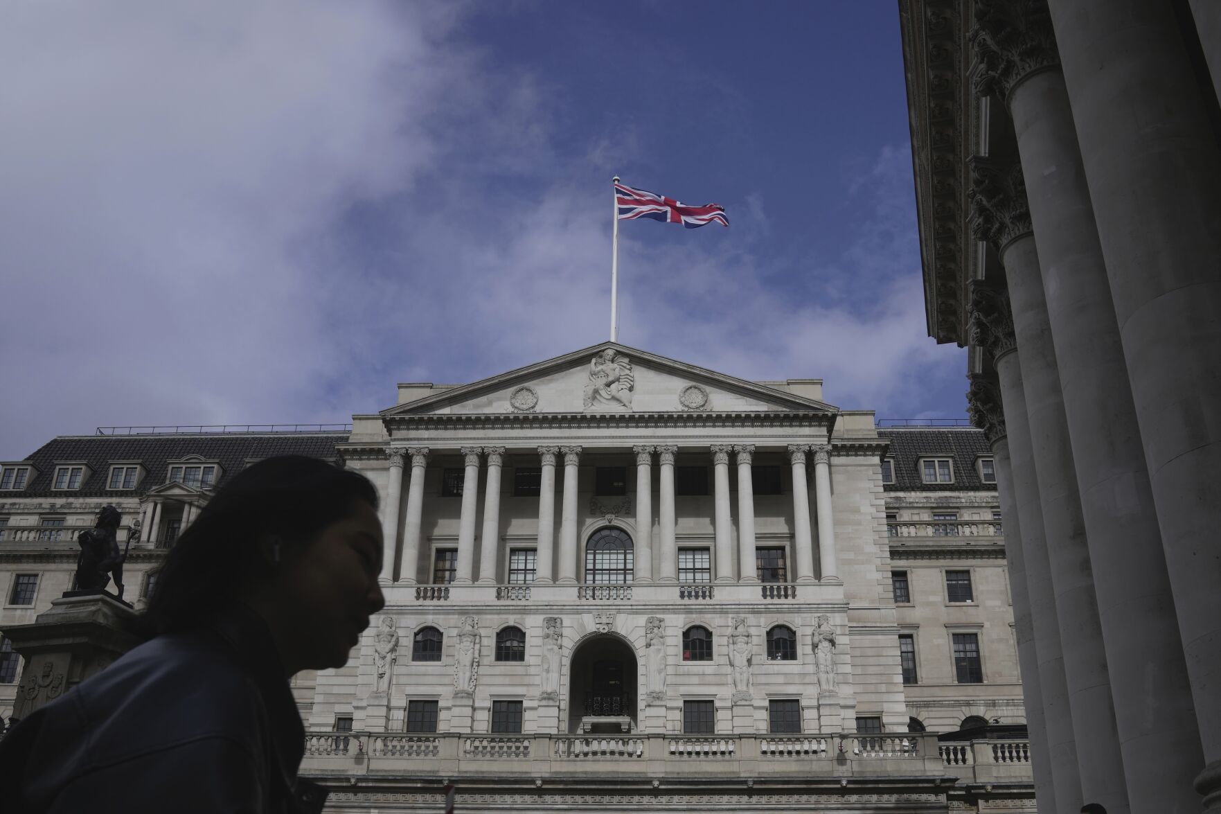 <p>FILE - A woman walks in front of the Bank of England, at the financial district in London, on March 23, 2023. The Bank of England is widely expected to indicate Thursday March 21, 2024 that interest rates could be cut in the coming months following news that inflation across the U.K. is falling faster than expected. (AP Photo/Kin Cheung, File)</p>   PHOTO CREDIT: Kin Cheung 