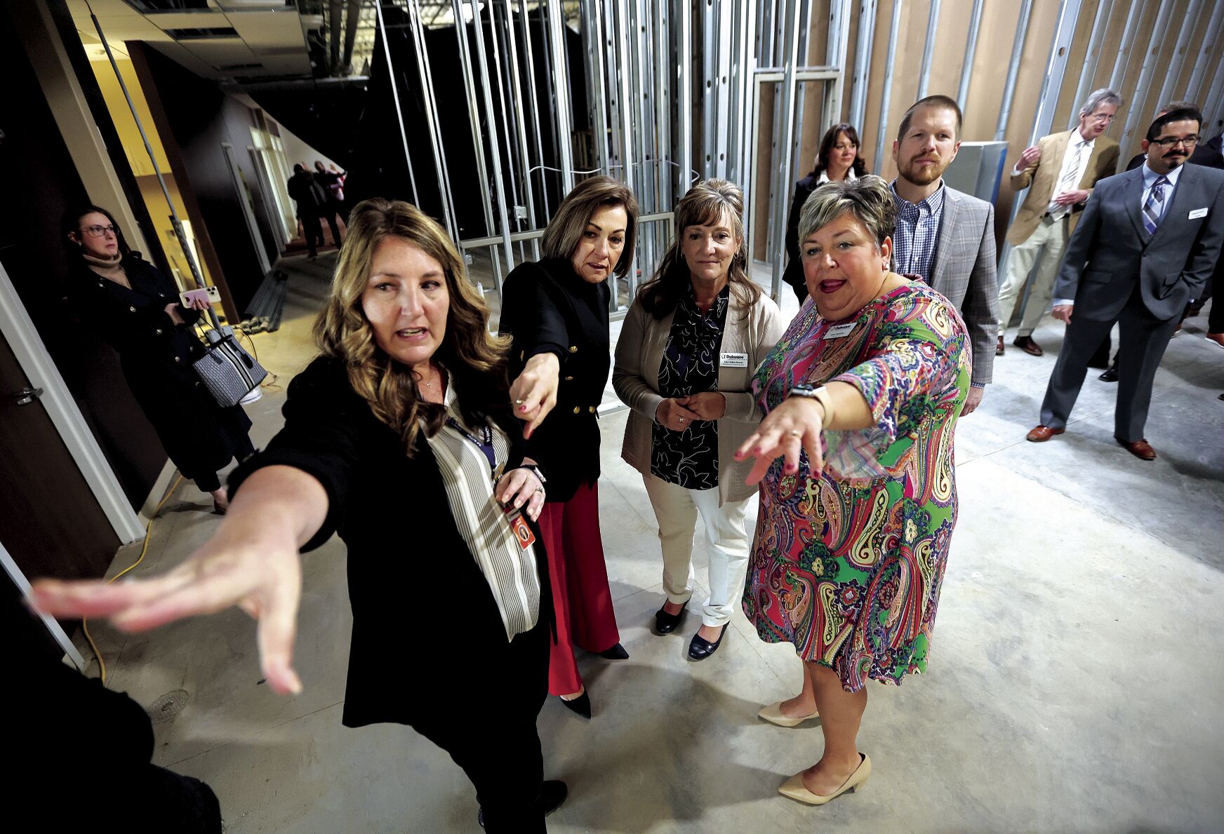 Dubuque Community Schools staff members Brenda Duvel (left), Lisa TeBockhorst (second from right) and Superintendent Amy Hawkins (right) give the governor a tour of the planned Seedlings Preschool Center on Chavenelle Road.    PHOTO CREDIT: Dave Kettering
