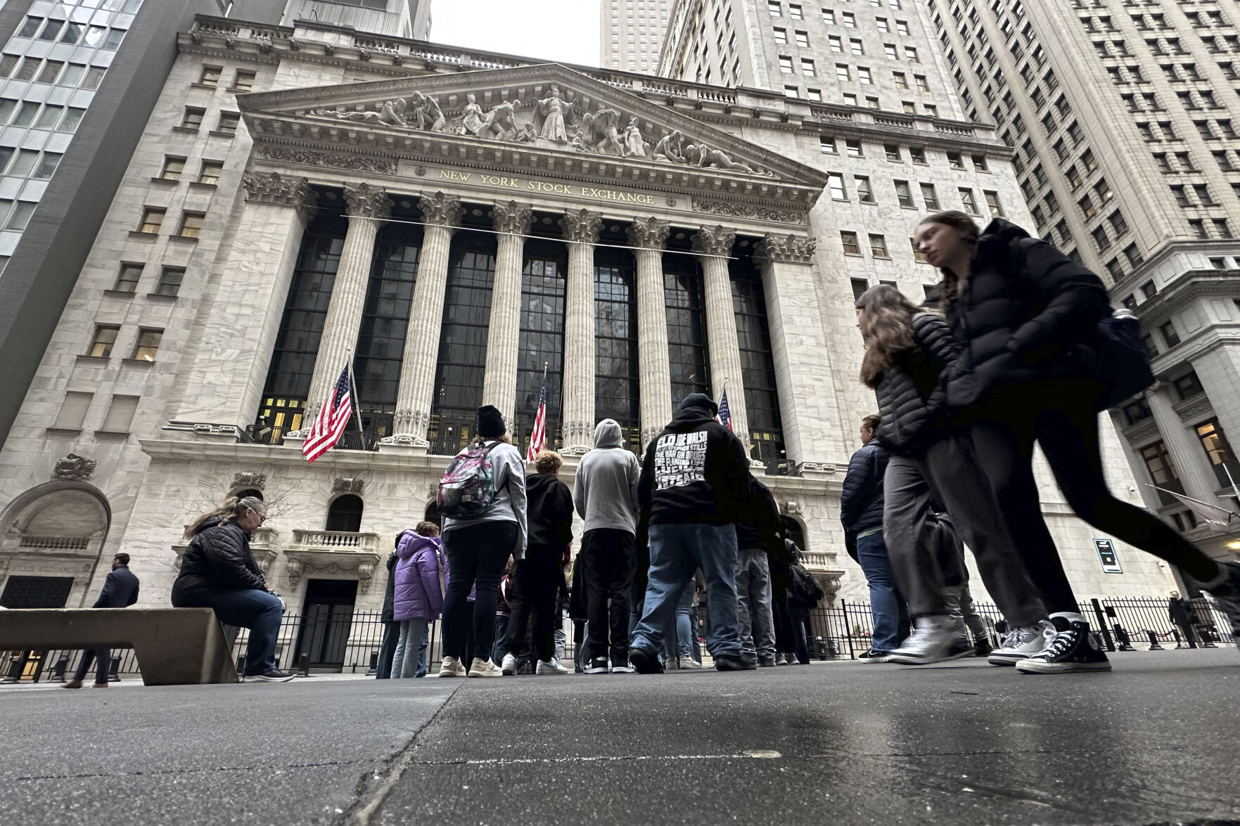 <p>People walk past the New York Stock Exchange Wednesday, March 27, 2024. World shares are mixed after Wall Street slipped a bit further from its record highs. (AP Photo/Peter Morgan)</p>   PHOTO CREDIT: Peter Morgan 