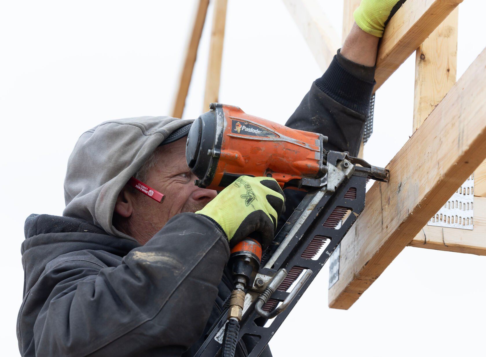 Chad Erner, with Carpenters Construction Services Inc., works on the home.    PHOTO CREDIT: Stephen Gassman
Telegraph Herald