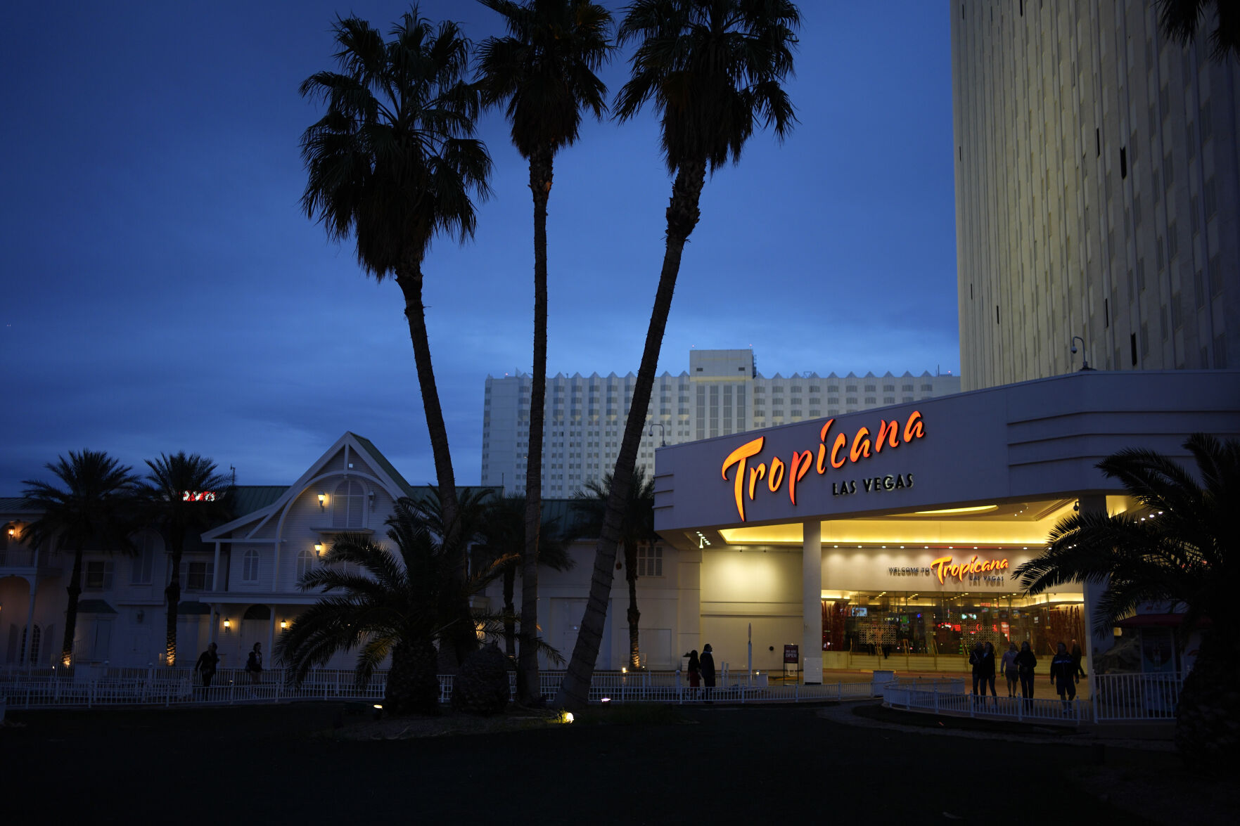 <p>People walk outside of the Tropicana hotel-casino Thursday, March 28, 2024, in Las Vegas. The property is scheduled to close April 2, 2024. (AP Photo/John Locher)</p>   PHOTO CREDIT: John Locher 