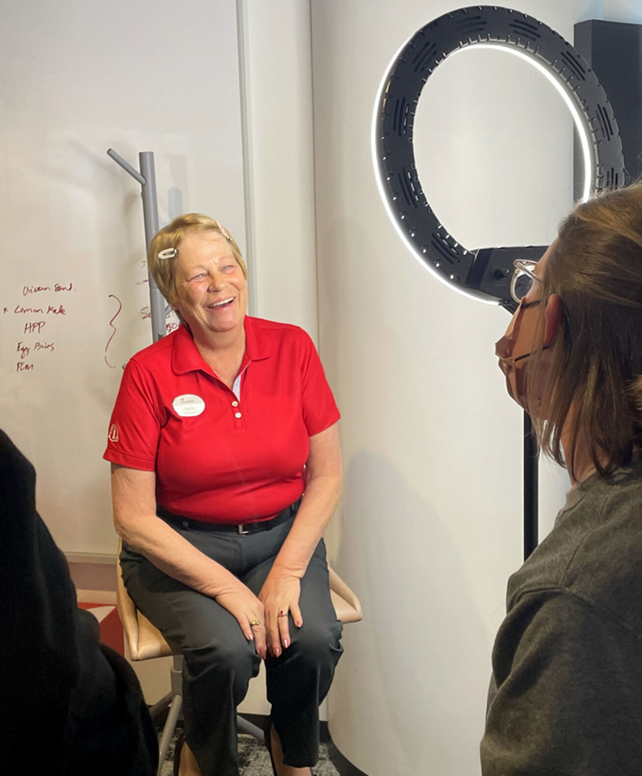 Bernie Tigges, an employee at Dubuque’s Chick-fil-A restaurant, was under the spotlight to film a commercial for the business that is currently airing nationwide.    PHOTO CREDIT: Contributed