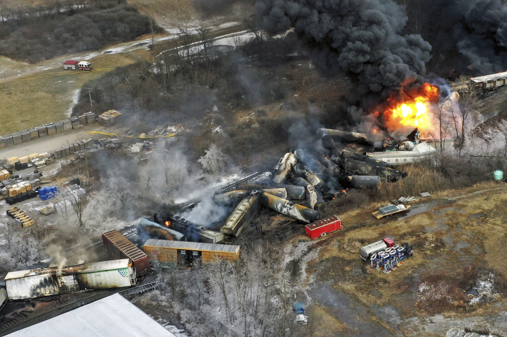 FILE - Debris from a Norfolk Southern freight train lies scattered and burning along the tracks on Feb. 4, 2023, the day after it derailed in East Palestine, Ohio. (AP Photo/Gene J. Puskar, File)    PHOTO CREDIT: Associated Press