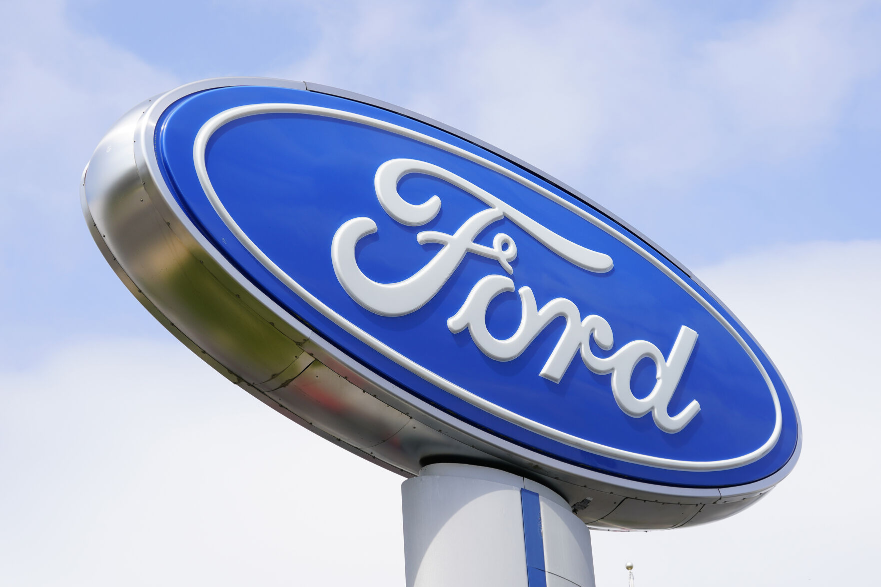 <p>FILE - A Ford sign is shown at a dealership in Springfield, Pa., Tuesday, April 26, 2022. Ford is recalling nearly 43,000 small SUVs, Wednesday, April 10, 2024, because gasoline can leak from the fuel injectors onto hot engine surfaces, increasing the risk of fires. But the recall remedy does not include repairing the fuel leaks.(AP Photo/Matt Rourke)</p>   PHOTO CREDIT: Matt Rourke - staff, ASSOCIATED PRESS