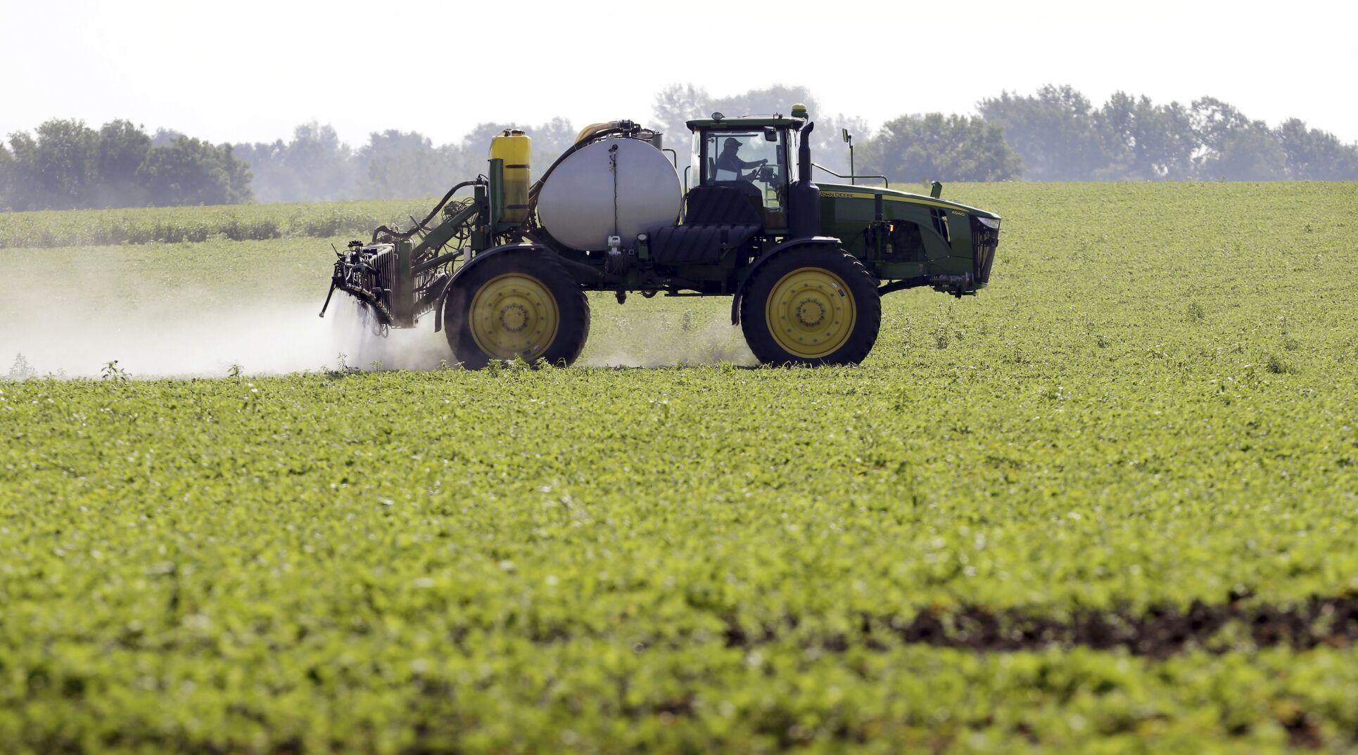 <p>FILE - A soybean field is sprayed in Iowa, July 11, 2013. The maker of a popular weedkiller is turning to lawmakers in key states to try to squelch legal claims that it failed to warn about cancer risks. (AP Photo/Charlie Neibergall, File)</p>   PHOTO CREDIT: Charlie Neibergall 