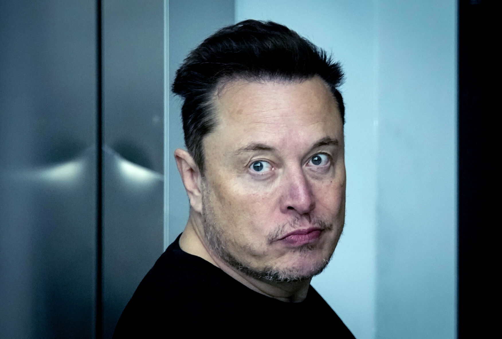 <p>FILE - Tesla CEO Elon Musk leaves the Tesla Gigafactory for electric cars after a visit in Gruenheide near Berlin, Germany, on March 13, 2024. Elon Musk will ask Tesla shareholders to reinstate the compensation package that was rejected by a judge in Delaware this year and to move the electric carmaker’s corporate home from Delaware to Texas. (AP Photo/Ebrahim Noroozi, File)</p>   PHOTO CREDIT: Ebrahim Noroozi 