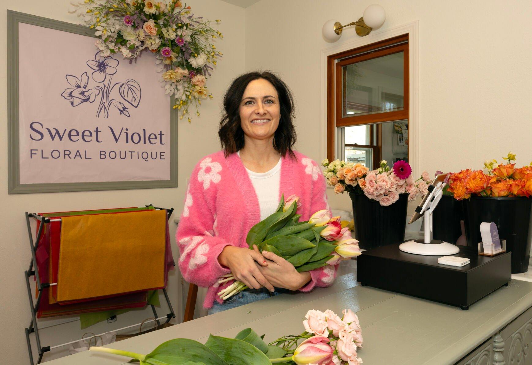 Owner Ellen Pinnola stands behind the counter at Sweet Violet Floral Boutique in Platteville, Wis., on Friday, April 19, 2024.    PHOTO CREDIT: Stephen Gassman