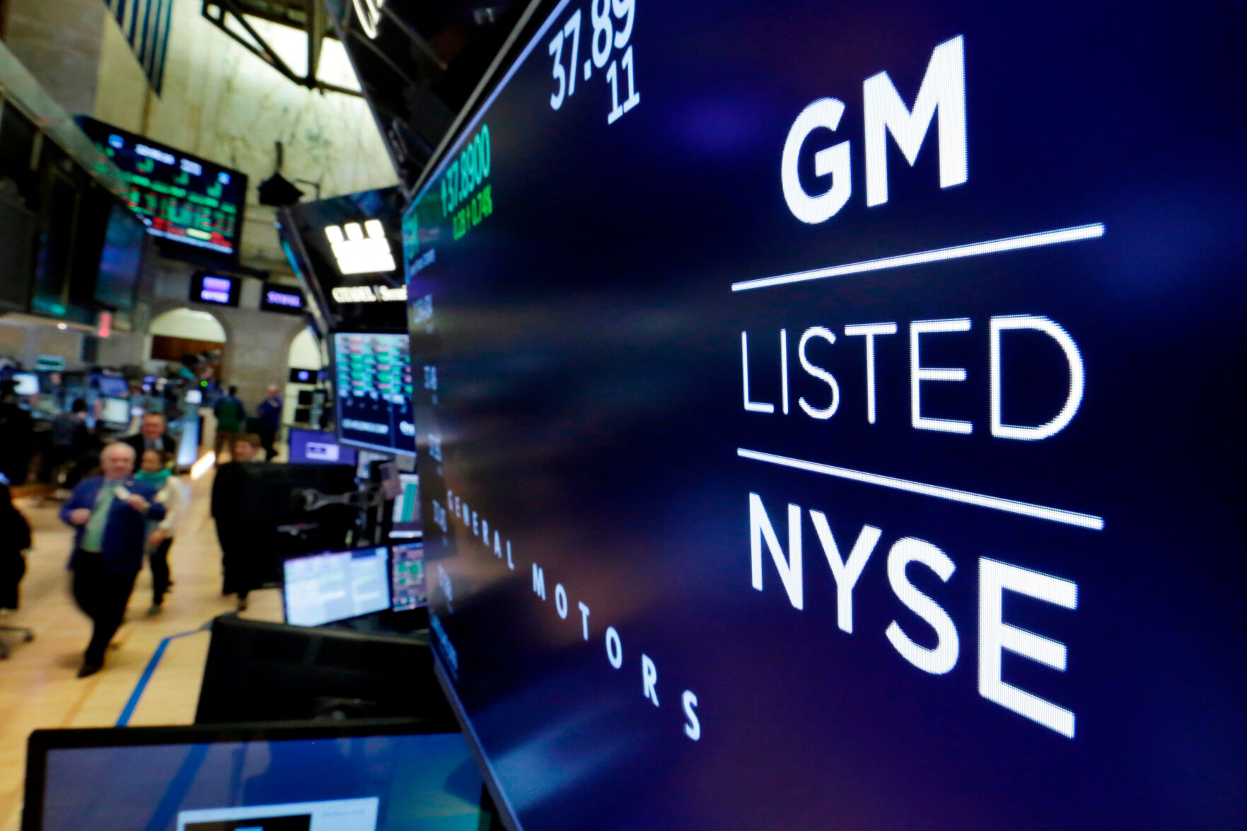 <p>FILE - In this April 23, 2018, file photo, the logo for General Motors appears above a trading post on the floor of the New York Stock Exchange. General Motors reports earnings on Tuesday, April 23, 2024. (AP Photo/Richard Drew, File)</p>   PHOTO CREDIT: Richard Drew