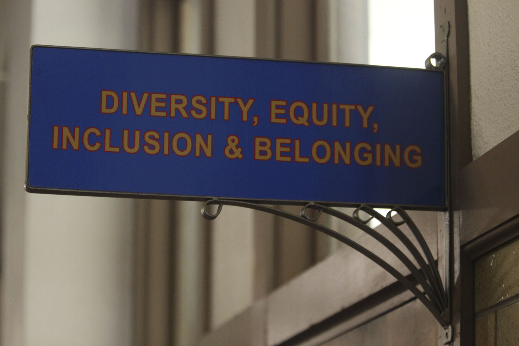 <p>FILE - The sign above the door to the Office of Diversity, Equity, Inclusion and Belonging inside the main administration building on the main University of Kansas campus is seen on Friday, April 12, 2024, in Lawrence, Kan. A conservative quest to limit diversity, equity and inclusion initiatives is gaining momentum in state capitals and college governing boards, with officials in about one-third of the states now taking some sort of action against it. (AP Photo/John Hanna, File)</p>   PHOTO CREDIT: John Hanna 