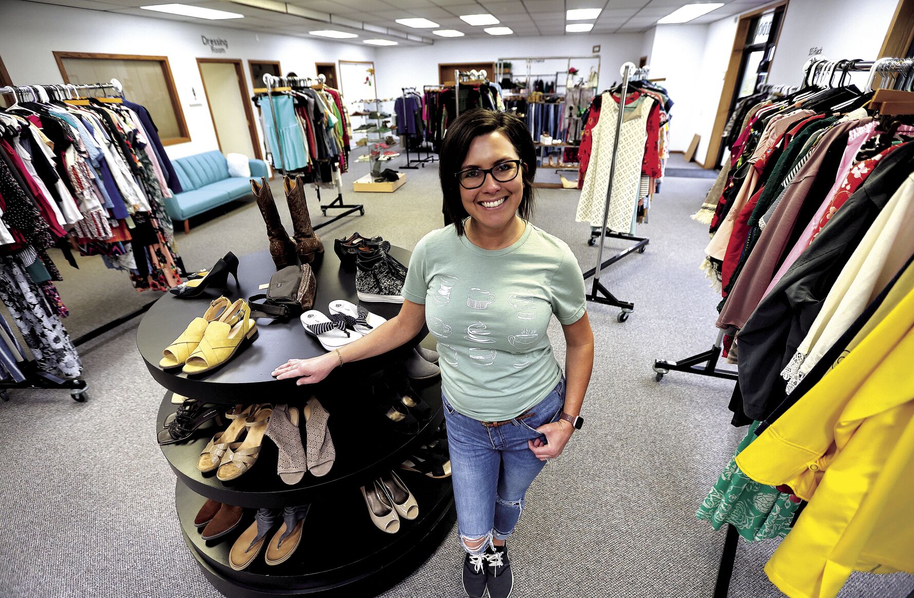 Samantha Wright, owner of Primrose, a consignment boutique, stands in the newly expanded area of the shop.    PHOTO CREDIT: Dave Kettering