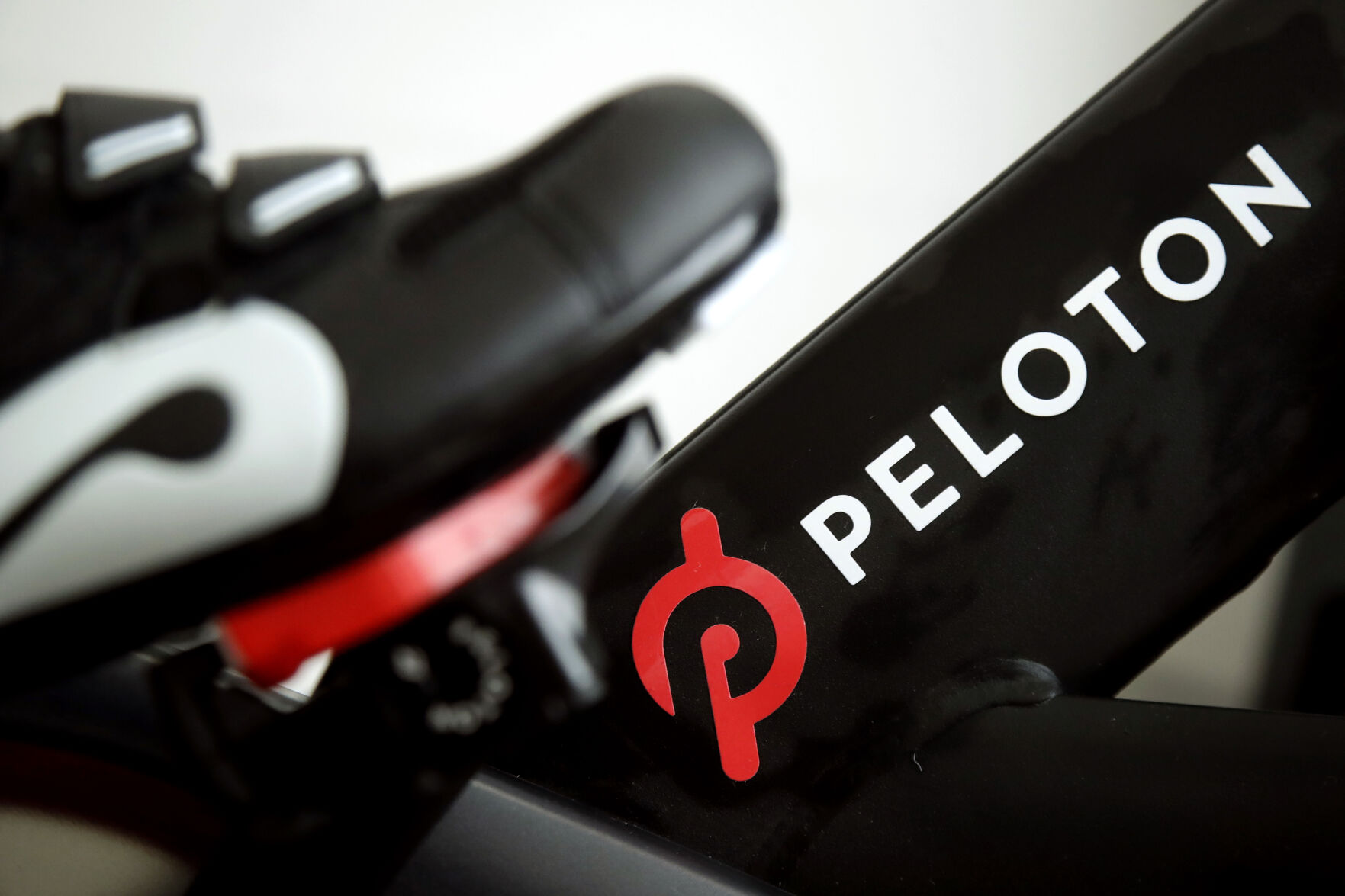 <p>FILE - This Nov. 19, 2019 file photo shows the logo on a Peloton bike in San Francisco. Peloton is cutting about 400 jobs worldwide as part of a restructuring effort and its CEO Barry McCarthy is stepping down after two years as the company continues to work on turning around its business. Peloton Interactive Inc. said Thursday, May 2, 2024 that the job reductions amount to approximately 15% of its global headcount. (AP Photo/Jeff Chiu, File)</p>   PHOTO CREDIT: Jeff Chiu - staff, ASSOCIATED PRESS