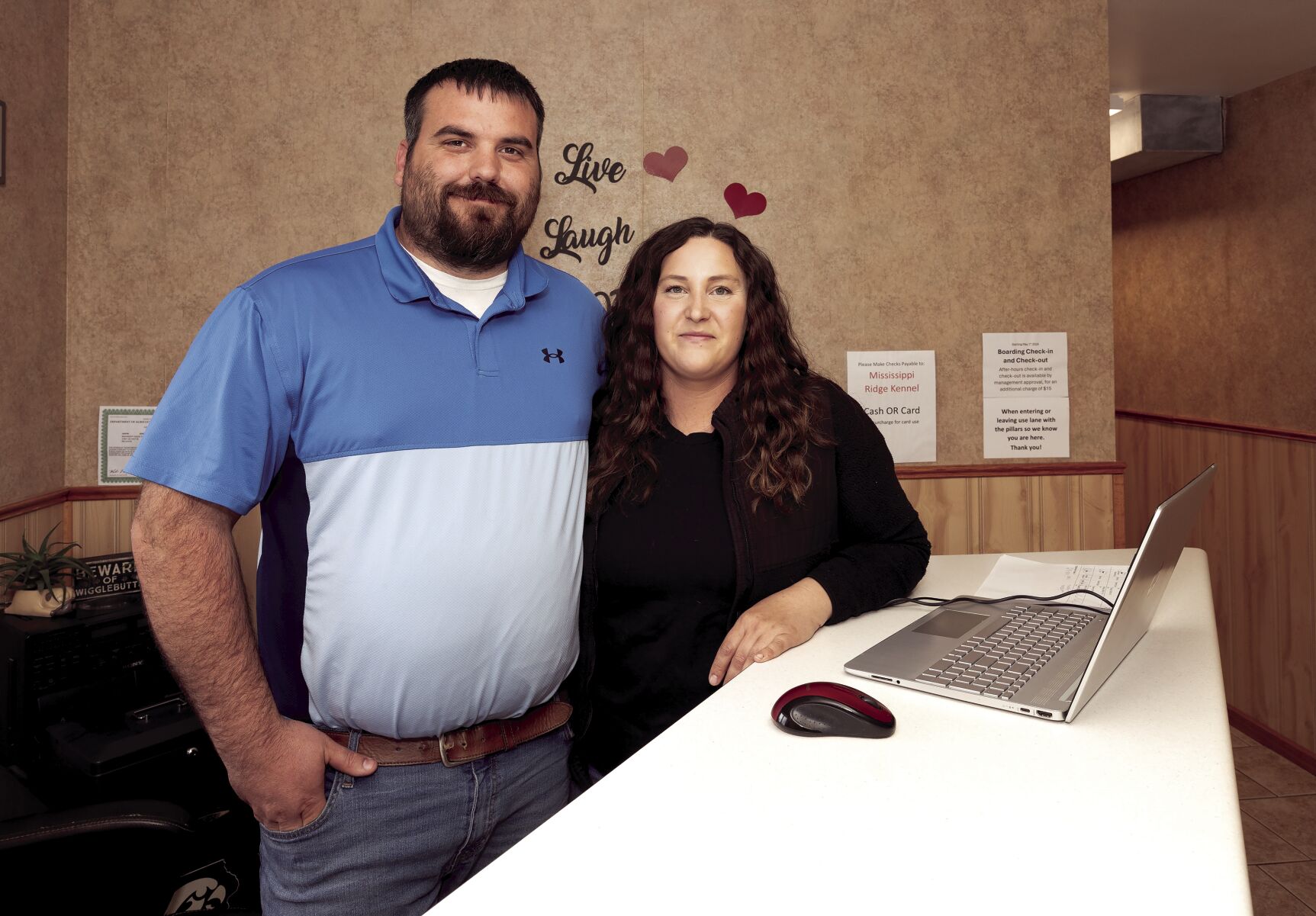 Jason and Haley Edwards stand in the lobby at Mississippi Ridge Kennel near Bellevue, Iowa.    PHOTO CREDIT: Stephen Gassman