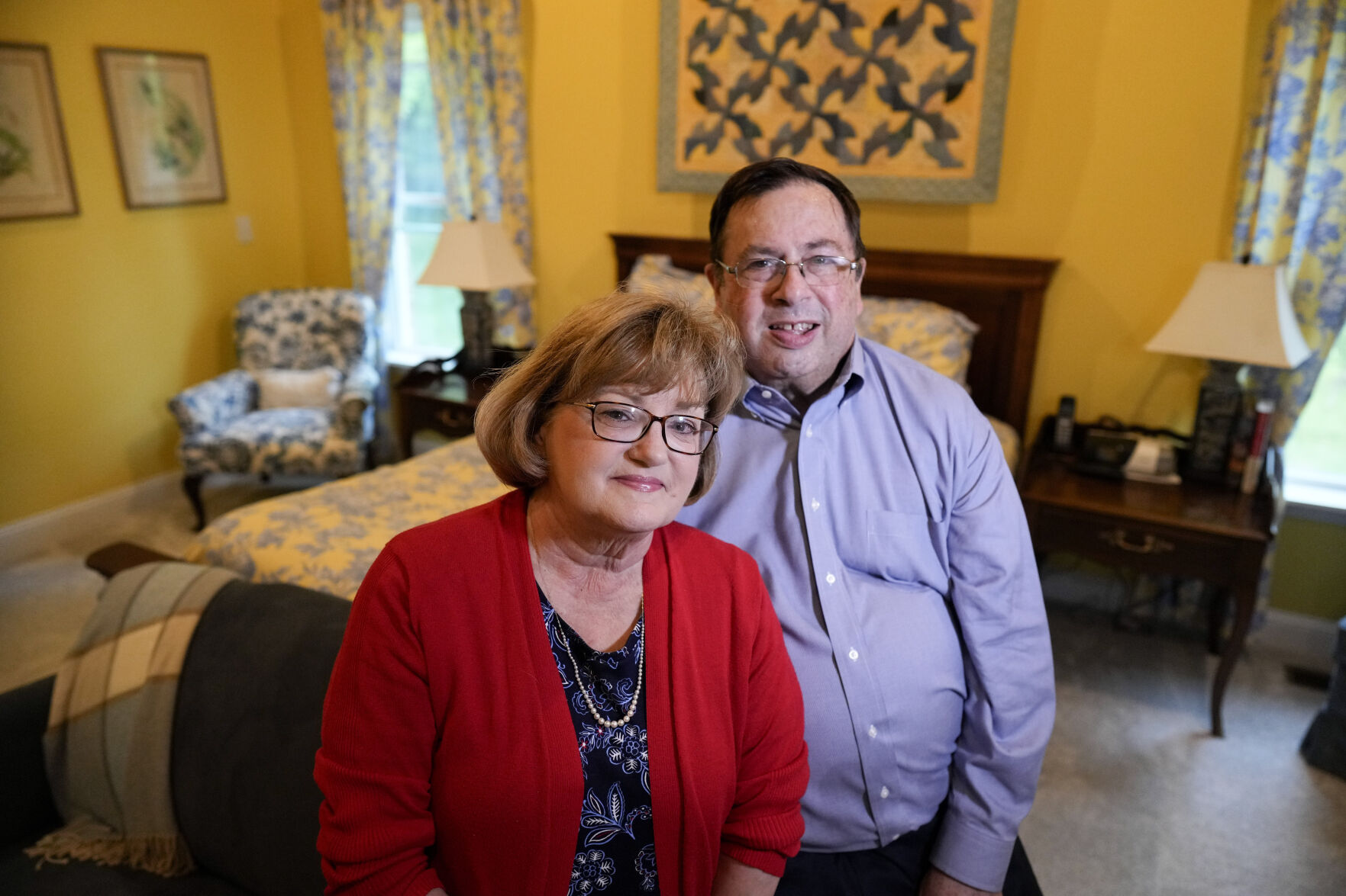 Gene and Sallie Carr pose for a picture in their recently remodeled home on Tuesday, May 7, 2024, in Hendersonville, N.C. An increasing number of Americans in their late 50s and older are staying in their houses, some by choice, others because they