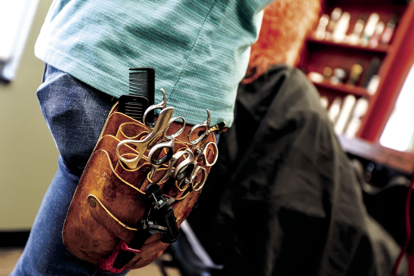 Owner of The Color Parlor, Christopher Bellings, has a tool belt built for his tools of the trade on Friday, May 10, 2024.    PHOTO CREDIT: Dave Kettering