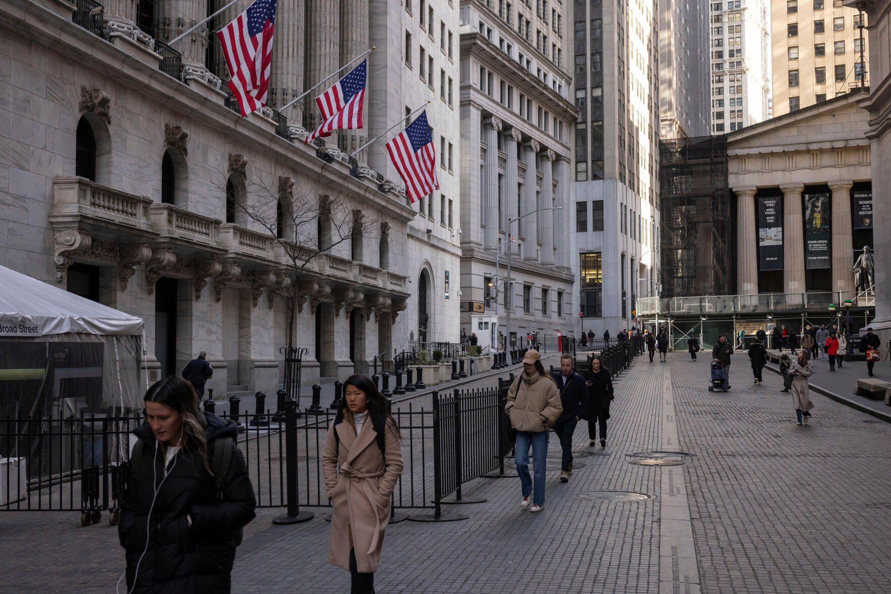 <p>FILE - People walk past the New York Stock Exchange on March. 21, 2024. World stocks are mixed on Monday, May 13, 2024, after Wall Street coasted to the close of another winning week. U.S. futures and oil prices were higher. (AP Photo/Yuki Iwamura, File)</p>   PHOTO CREDIT: Yuki Iwamura - freelancer, ASSOCIATED PRESS