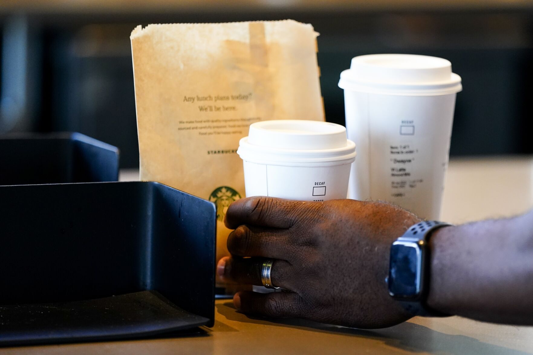 <p>FILE - A customer picks up a drink at a Starbucks location on June 28, 2023, in Seattle. On Wednesday, May 15, 2024, the Commerce Department releases U.S. retail sales data for April. (AP Photo/Lindsey Wasson, File)</p>   PHOTO CREDIT: Lindsey Wasson - staff, ASSOCIATED PRESS