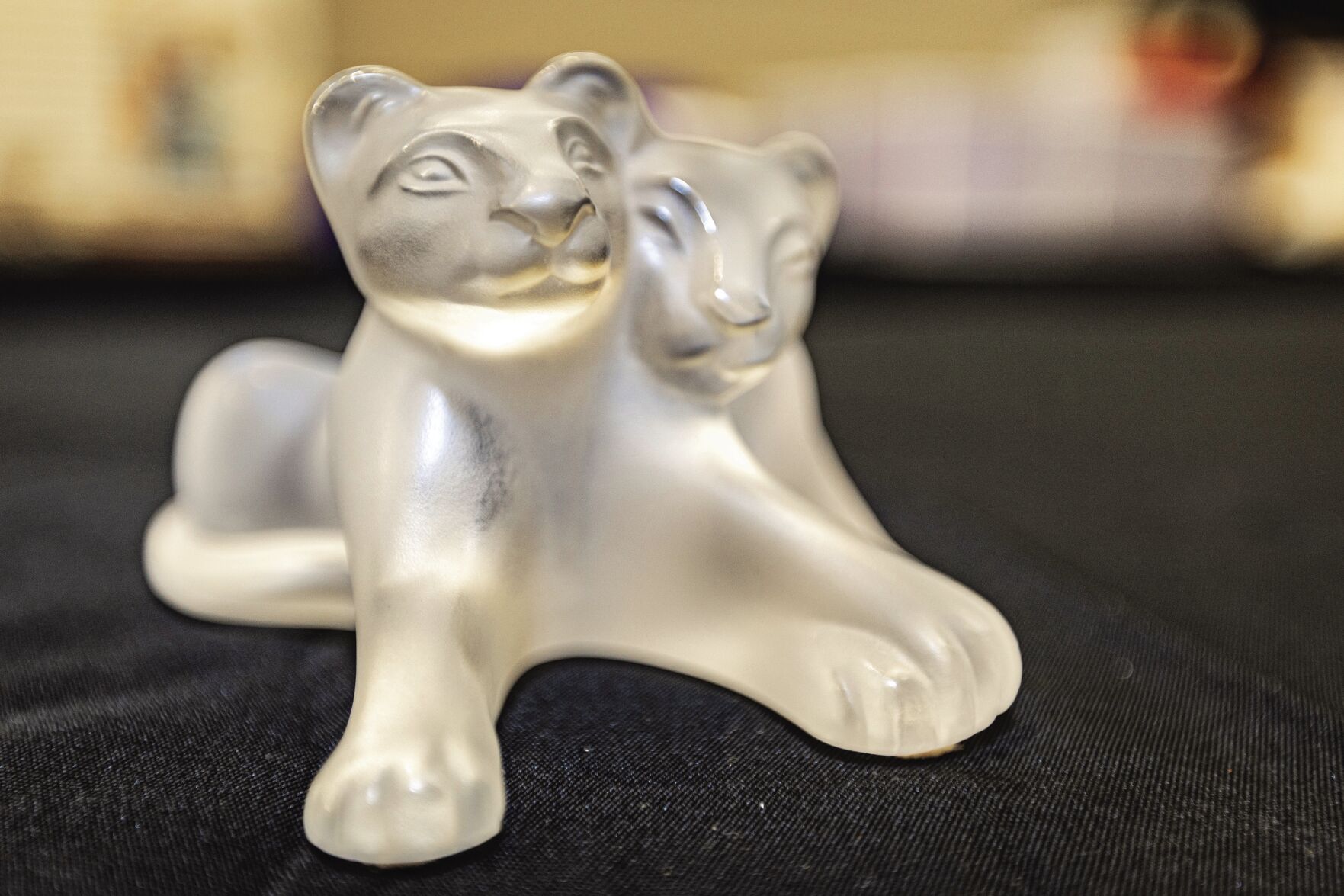 This Lalique Lion Cubs Tambwe piece is part of a crystal collection that Bravo Auctioneers has on its current auction lot.    PHOTO CREDIT: Thomas Eckermann
