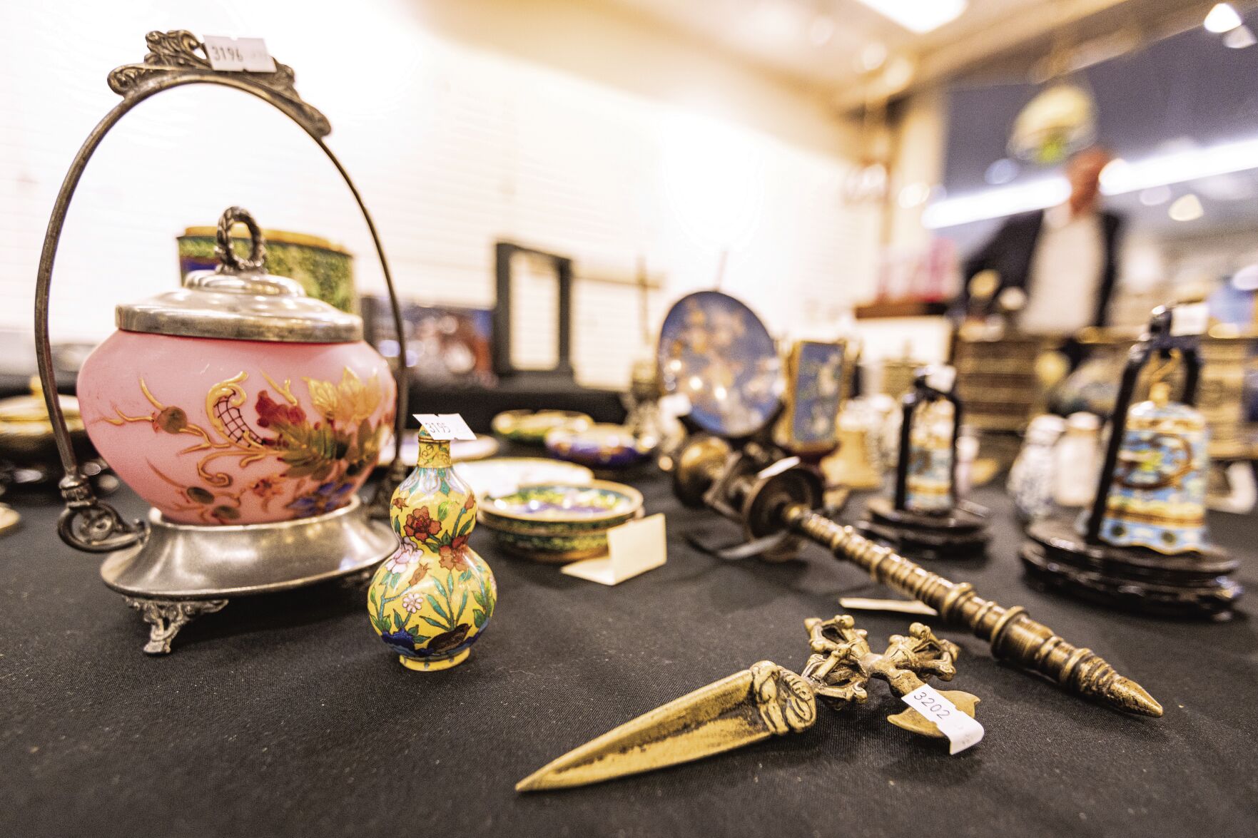 Various items up for auction are displayed at Bravo Auctioneers.    PHOTO CREDIT: Thomas Eckermann