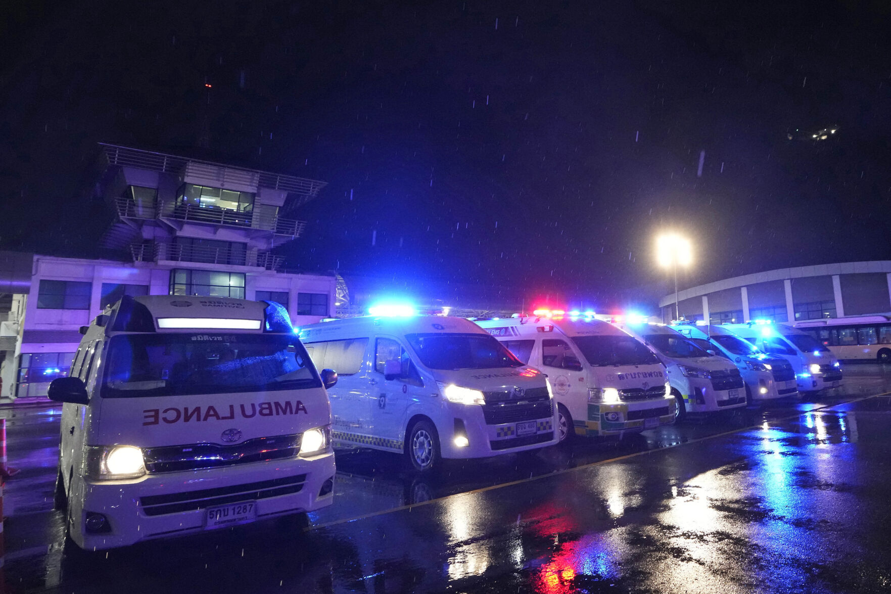 <p>Ambulances wait to carry passengers from a London-Singapore flight that encountered severe turbulence, in Bangkok, Thailand, Tuesday, May 21, 2024. The plane apparently plummeted for a number of minutes before it was diverted to Bangkok, where emergency crews rushed to help injured passengers amid stormy weather, Singapore Airlines said Tuesday. (AP Photo/Sakchai Lalit)</p>   PHOTO CREDIT: Sakchai Lalit