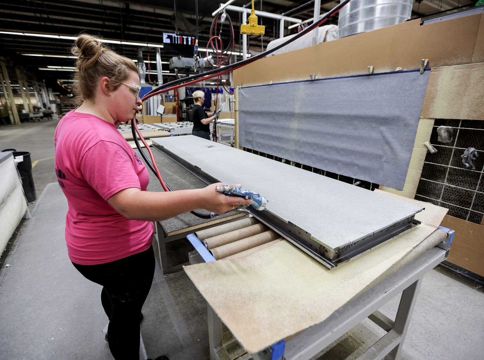 Modernfold employee Jaclyn Wagner works on a product on one of the company’s assembly lines.    PHOTO CREDIT: Dave Kettering