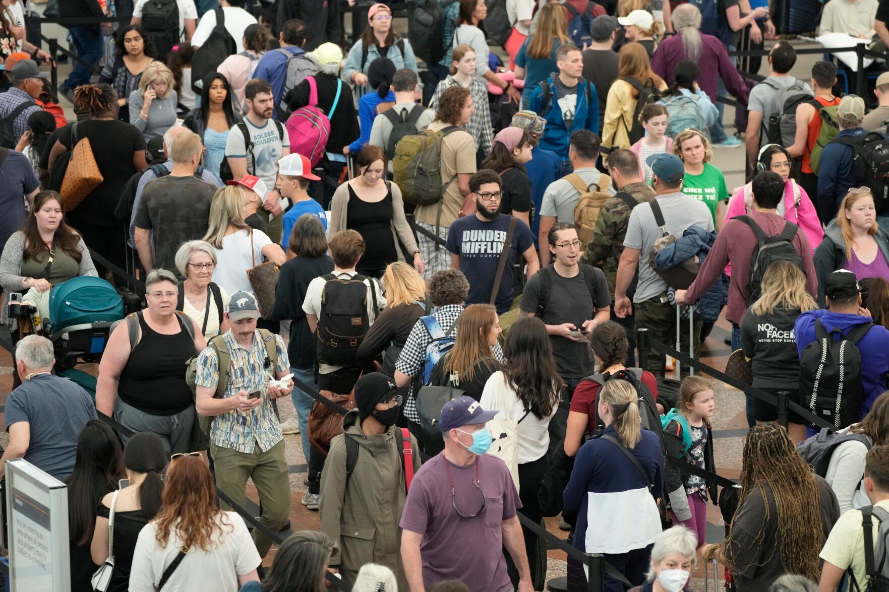 <p>FILE - Travelers move through a security checkpoint in Denver International Airport ahead of the Memorial Day holiday on May 26, 2023, in Denver. A record number of Americans are expected to hit the pavement and the air over the 2024 Memorial Day weekend. (AP Photo/David Zalubowski, File)</p>   PHOTO CREDIT: David Zalubowski 