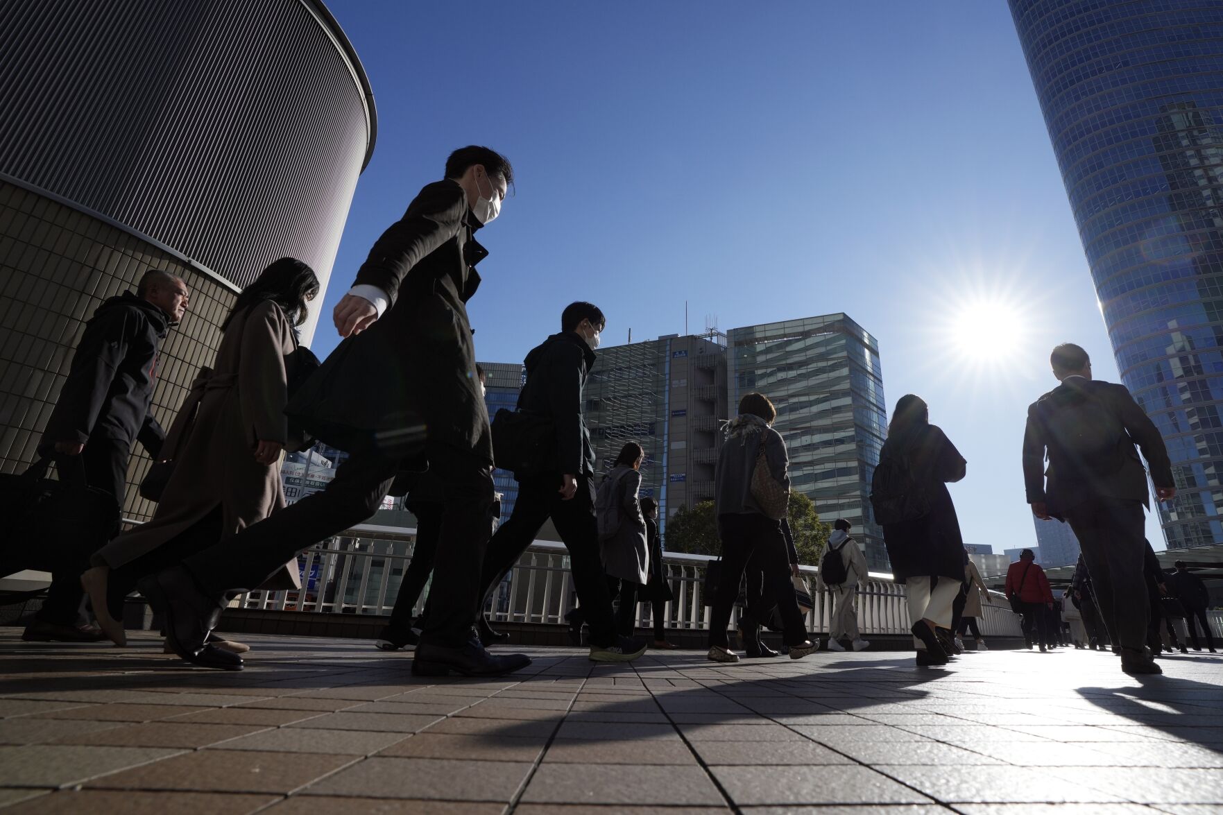 <p>FILE - Commuters walk in a passageway during a rush hour at Shinagawa Station Wednesday, Feb. 14, 2024, in Tokyo. As economies in Asia and the Pacific slow and grow older, countries need to do more to ensure that workers get the education, training and social safety nets needed to raise incomes and ensure social equity, a United Nations report said Tuesday, May 28. (AP Photo/Eugene Hoshiko, File)</p>   PHOTO CREDIT: Eugene Hoshiko 