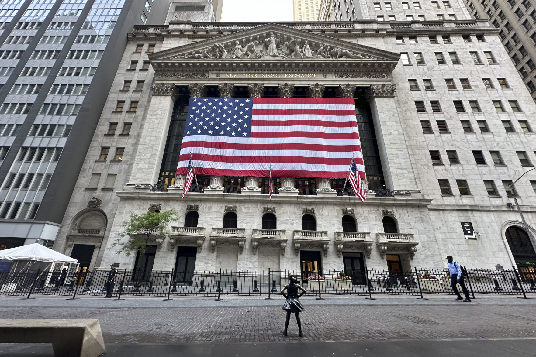 <p>FILE - People pass the New York Stock Exchange on May 28, 2024, in New York. Shares have opened higher in Europe on Thursday, May 30, 2024, after a retreat in Asia. U.S. futures sank and oil prices fell back.(AP Photo/Peter Morgan, File)</p>   PHOTO CREDIT: Peter Morgan - staff, ASSOCIATED PRESS