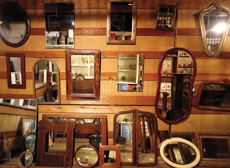 Mirrors are displayed at Antiques & Salvage in Cuba City, Wis.    PHOTO CREDIT: TH file