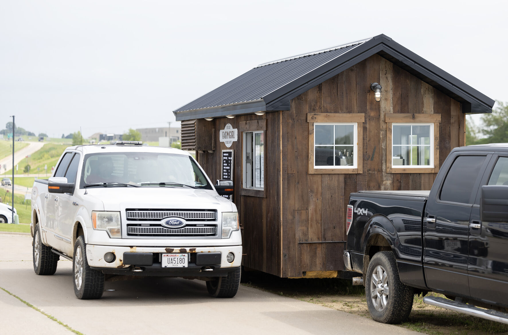 A drive-up customer waits for their drink at FarmGirl Coffee Shoppe truck in Kieler, Wis., on Monday.    PHOTO CREDIT: Stephen Gassman