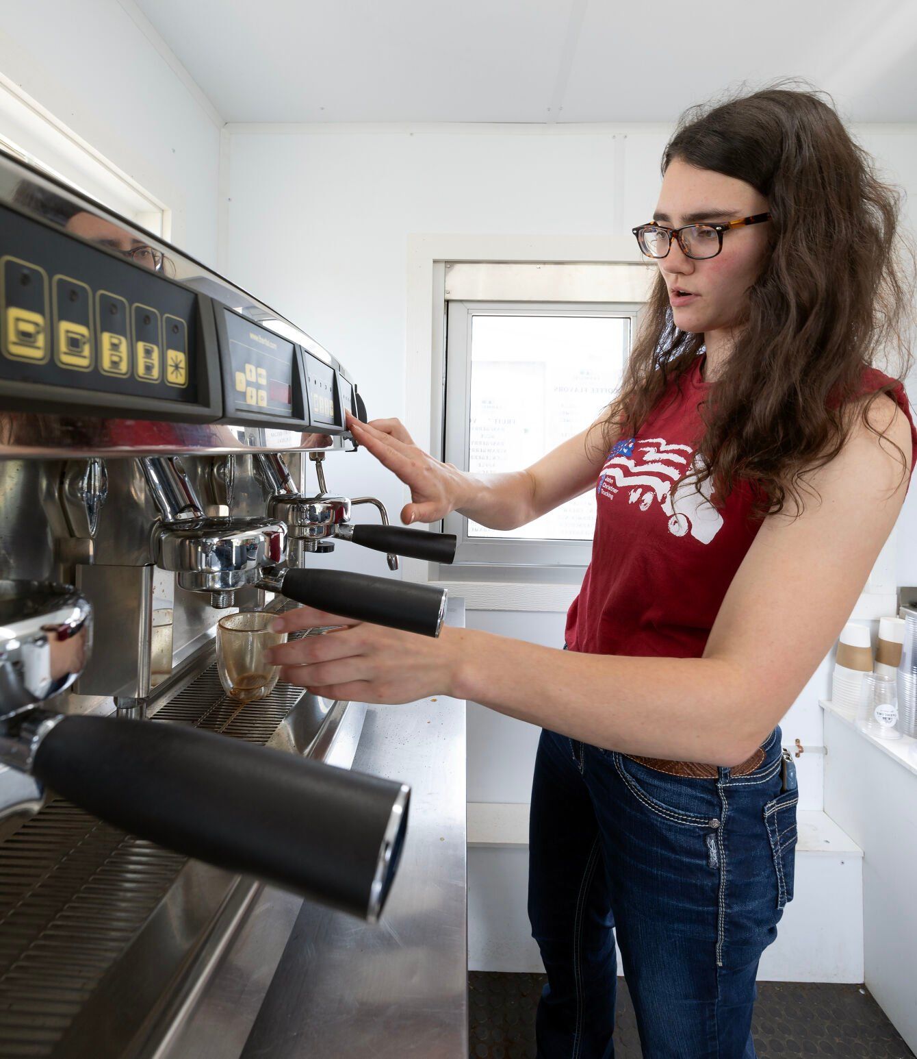 Owner Tabitha Vosberg prepares a beverage inside her coffee truck.    PHOTO CREDIT: Gassman