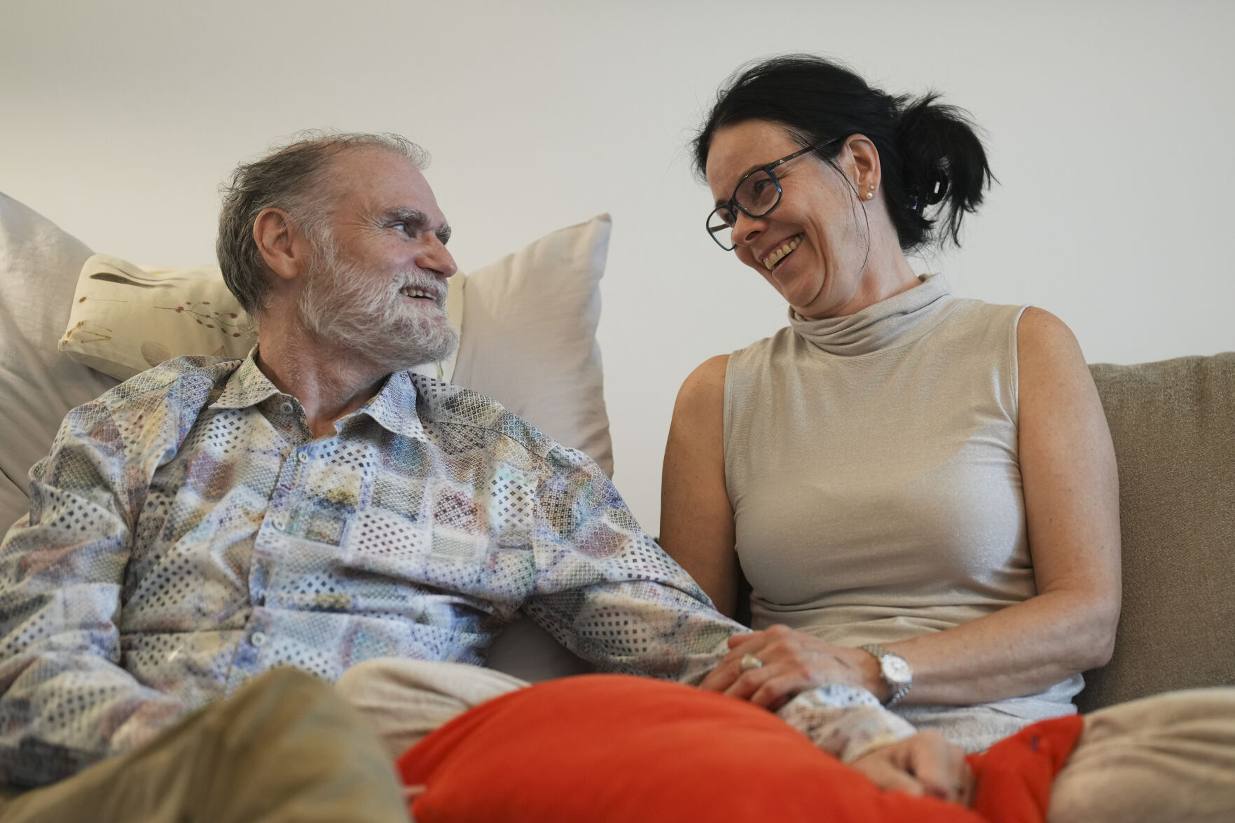 <p>Michael Bommer, left, who is terminally ill with colon cancer, looks at his wife Anett Bommer during a meeting with The Associated Press at his home in Berlin, Germany, Wednesday, May 22, 2024. Bommer, who has only a few more weeks to live, teamed up with friend who runs the AI-powered legacy platform Eternos to "create a comprehensive, interactive AI version of himself, allowing relatives to engage with his life experiences and insights," after he has passed away. (AP Photo/Markus Schreiber)</p>   PHOTO CREDIT: Markus Schreiber 