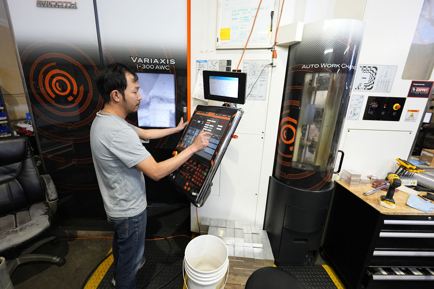 <p>FILE - A worker at Reata Engineering and Machine Works programs a Mazak Variaxis machine used to make semiconductor pieces on Feb. 15, 2024, in Englewood, Colo. On Friday, June 7, 2024, the U.S. government issues its May jobs report. (AP Photo/David Zalubowski, File)</p>   PHOTO CREDIT: David Zalubowski - staff, ASSOCIATED PRESS