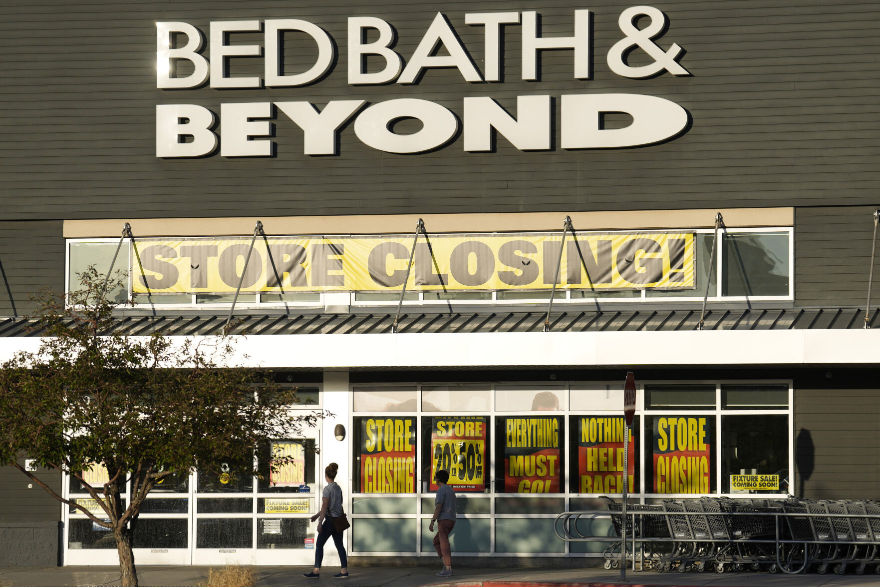 Shoppers enter a Bed Bath & Beyond store Monday, May 29, 2023, in Glendale, Colo. An Associated Press analysis found the number of publicly-traded “zombie” companies — those so laden with debt they