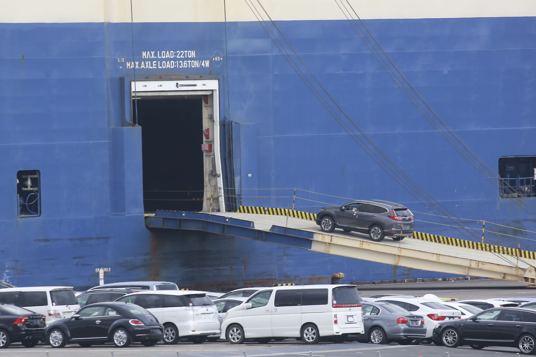 <p>FILE - Cars for export are loaded onto a cargo ship at a port in Yokohama, near Tokyo on Nov. 2, 2021. The Japanese economy shrank at an annual rate of 1.8% in the first quarter of this year, according to government data Monday, June 10, 2024, revised to be slightly better than the initial estimate at a 2.0% contraction. (AP Photo/Koji Sasahara, File)</p>   PHOTO CREDIT: Koji Sasahara 