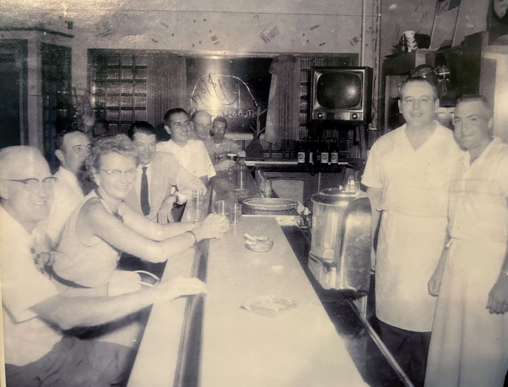 Frederick “Fritz” Willenborg (second from right), established The Ritz in 1948 and operated it until his retirement in 1975.    PHOTO CREDIT: Contributed