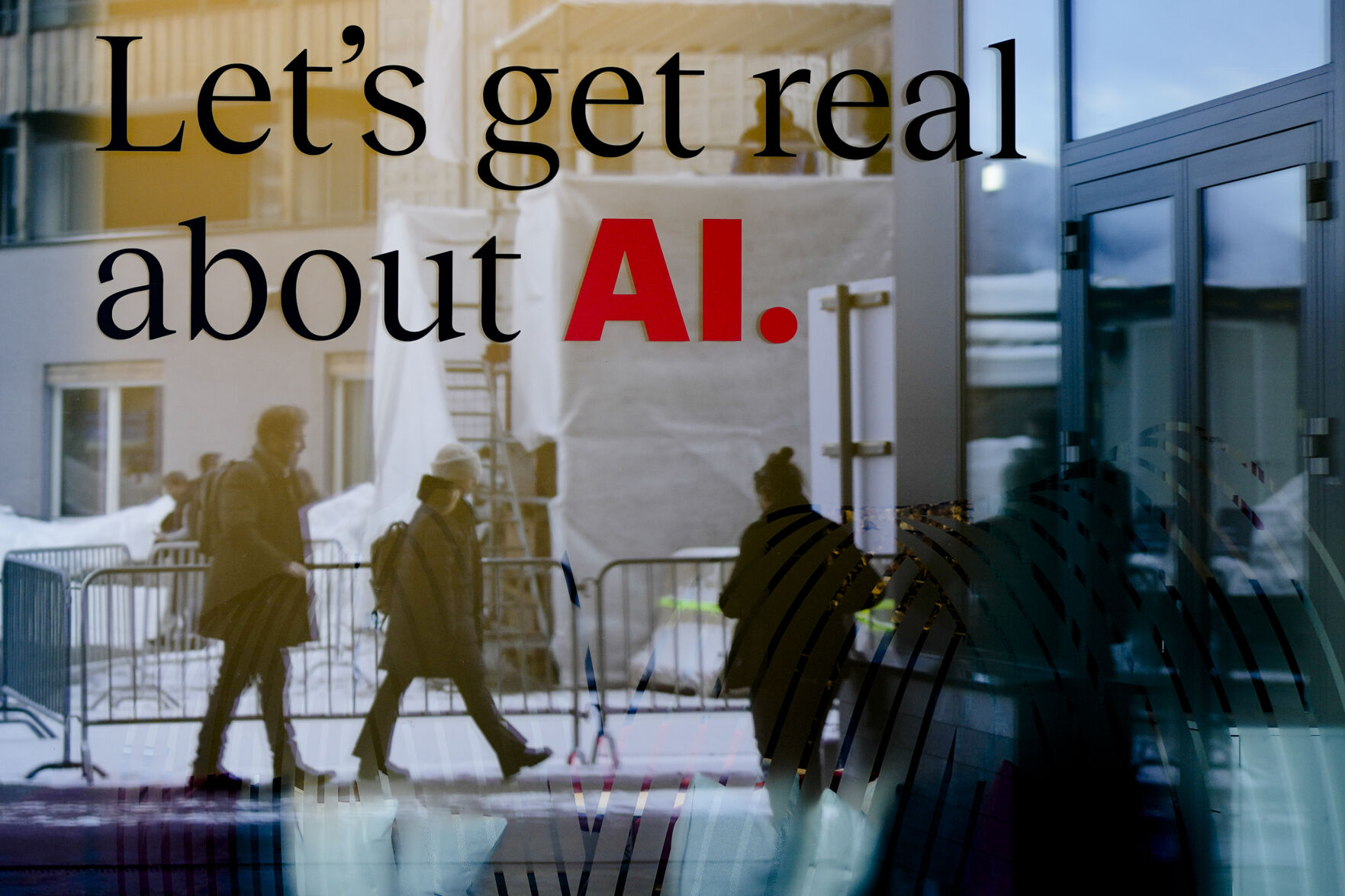 <p>FILE - People are reflected in a window of a hotel at the Davos Promenade in Davos, Switzerland, Jan. 15, 2024. The artificial intelligence startup Perplexity AI has raised tens of millions of dollars from the likes of Jeff Bezos and other prominent tech investors for its mission to rival Google in the business of searching for information. (AP Photo/Markus Schreiber, File)</p>   PHOTO CREDIT: Markus Schreiber - staff, ASSOCIATED PRESS