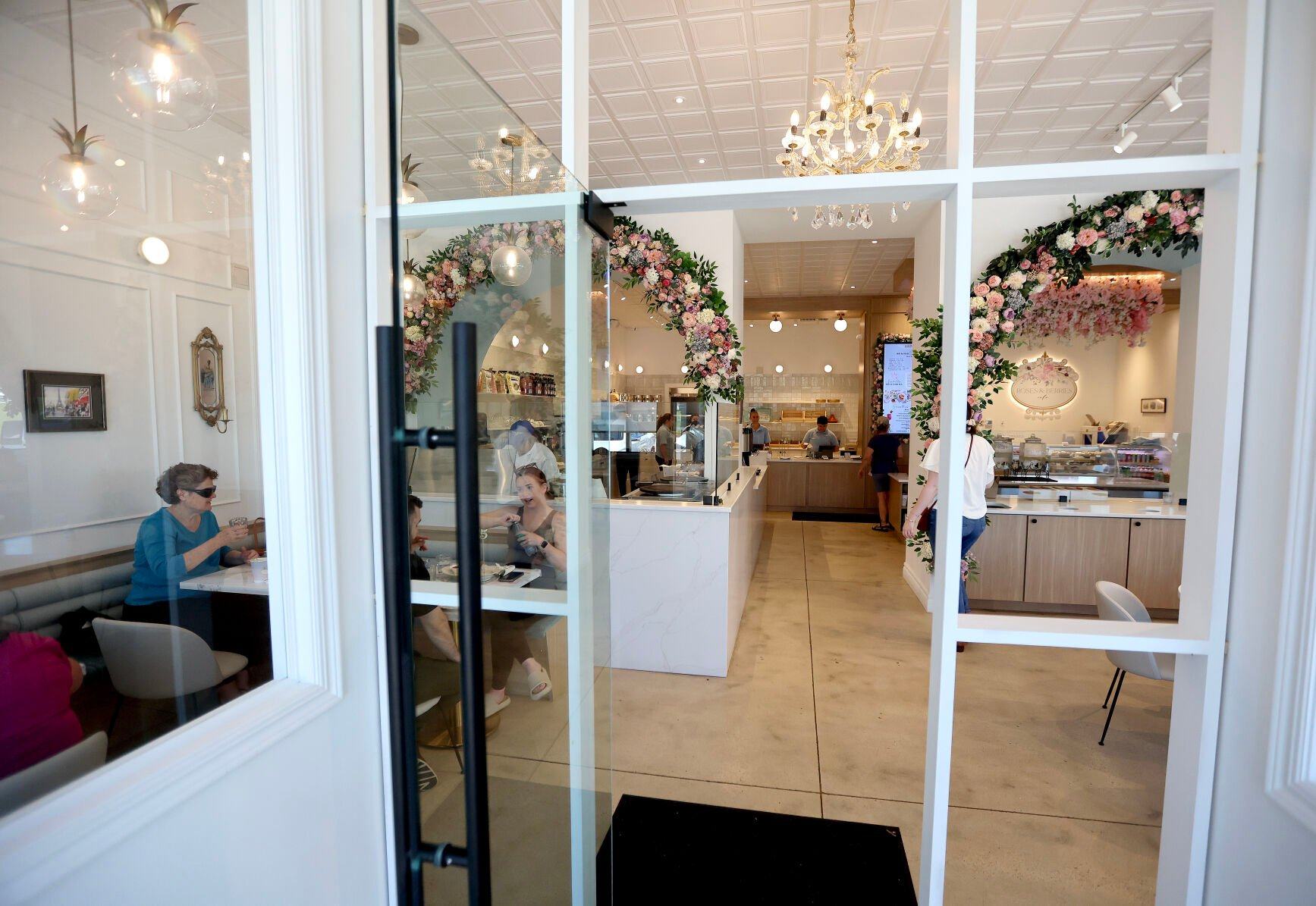 People enjoy their lunch inside Roses & Berries Cafe in Dubuque on Friday, June 14, 2024.    PHOTO CREDIT: Dave Kettering