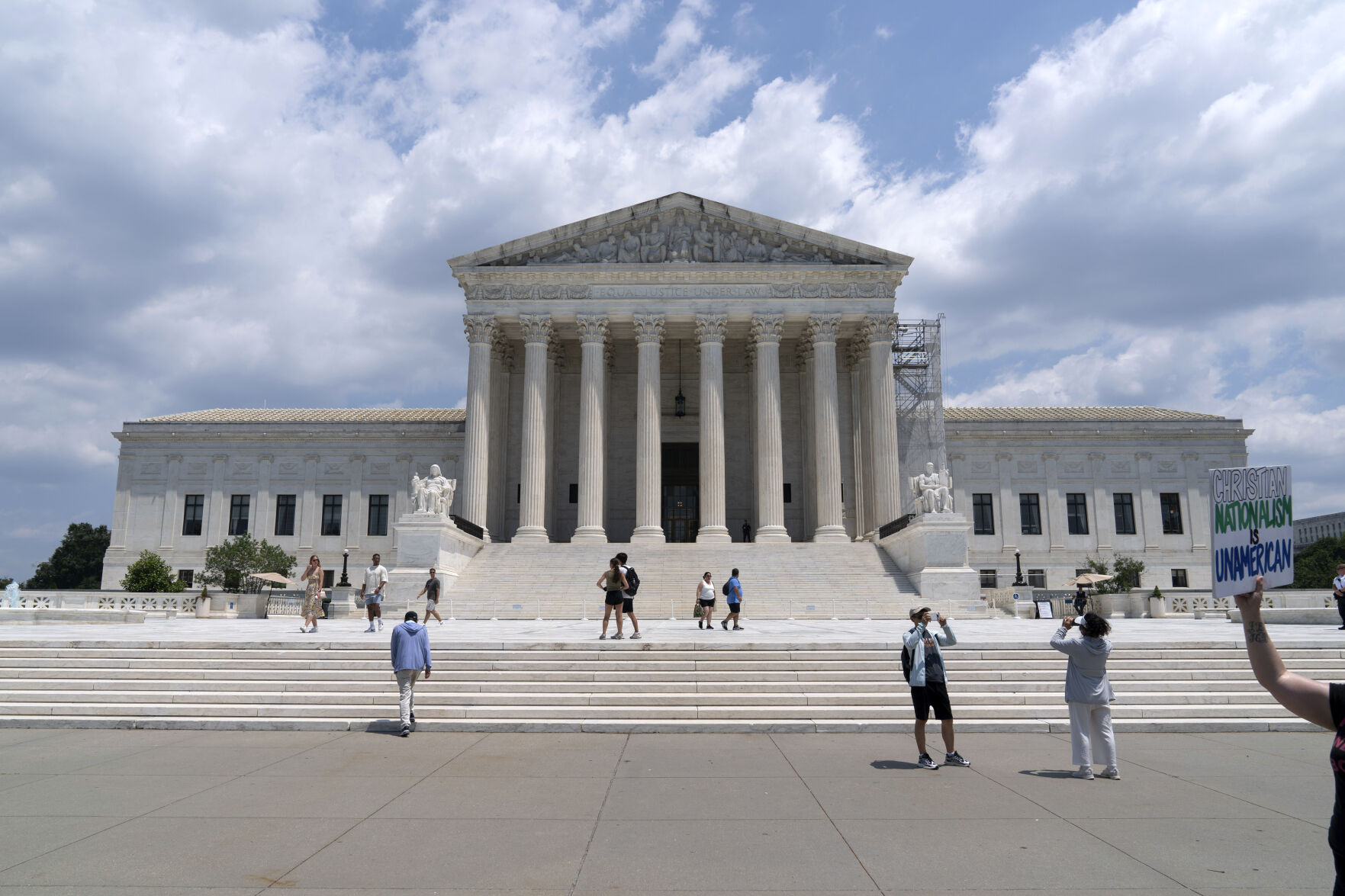 <p>Visitors pose for photographs outside the U.S. Supreme Court Tuesday, June 18, 2024, in Washington. ( AP Photo/Jose Luis Magana)</p>   PHOTO CREDIT: Jose Luis Magana 